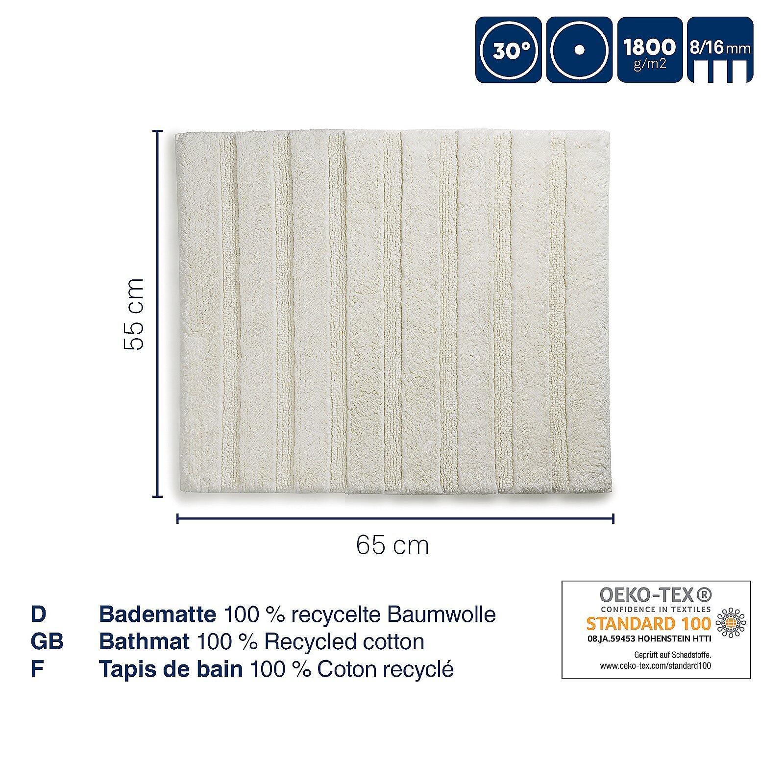 Flauschte Badematte Megan aus recycelter Baumwolle mit Detailaufnahme der Textur und OEKO-TEX Standard 100 Siegel.
