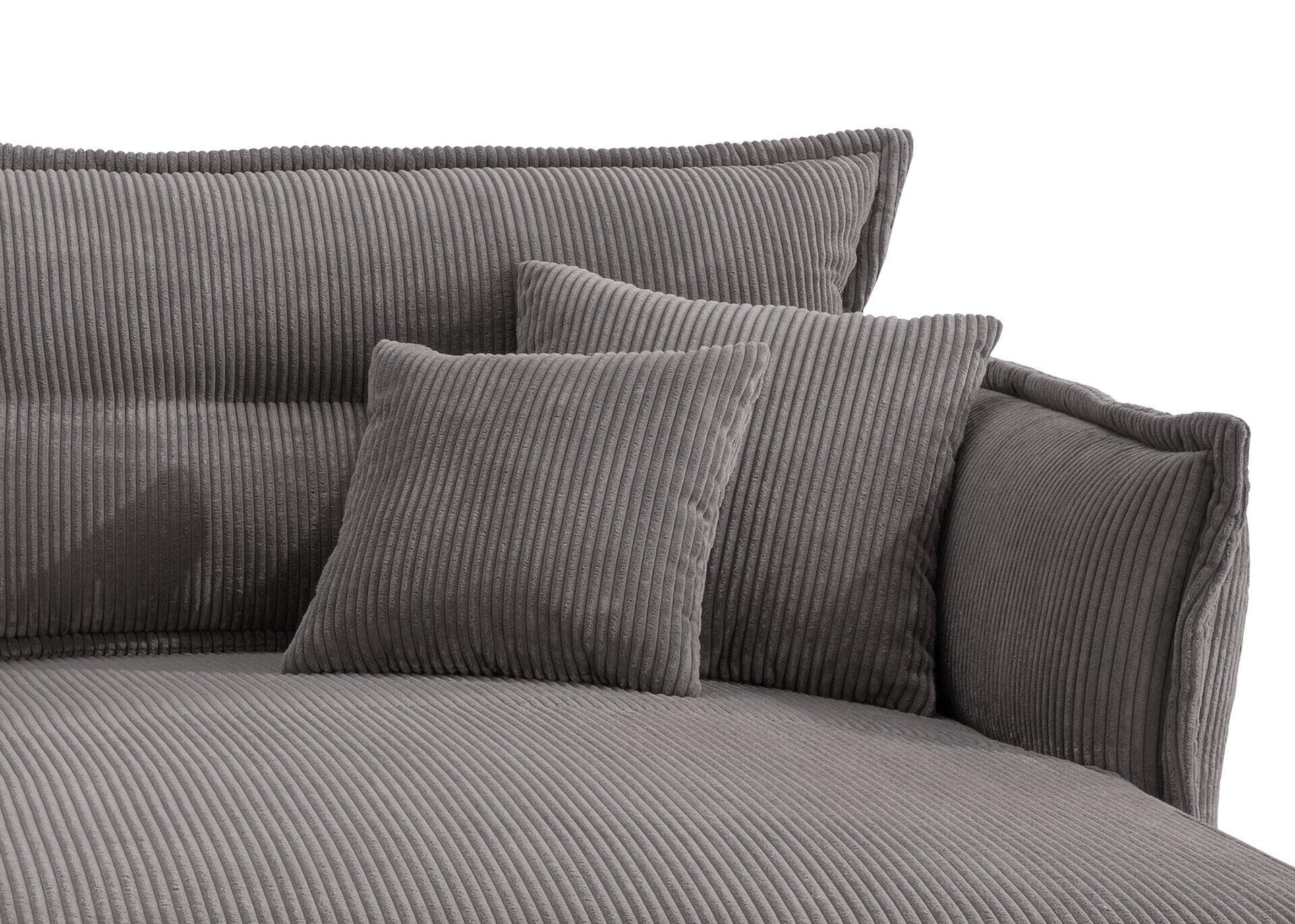 Graues Ecksofa "Lava" mit Cordbezug, hochgewellter Rückenlehne und quadratischem Kissen, Detailaufnahme aus leicht erhöhter Perspektive.