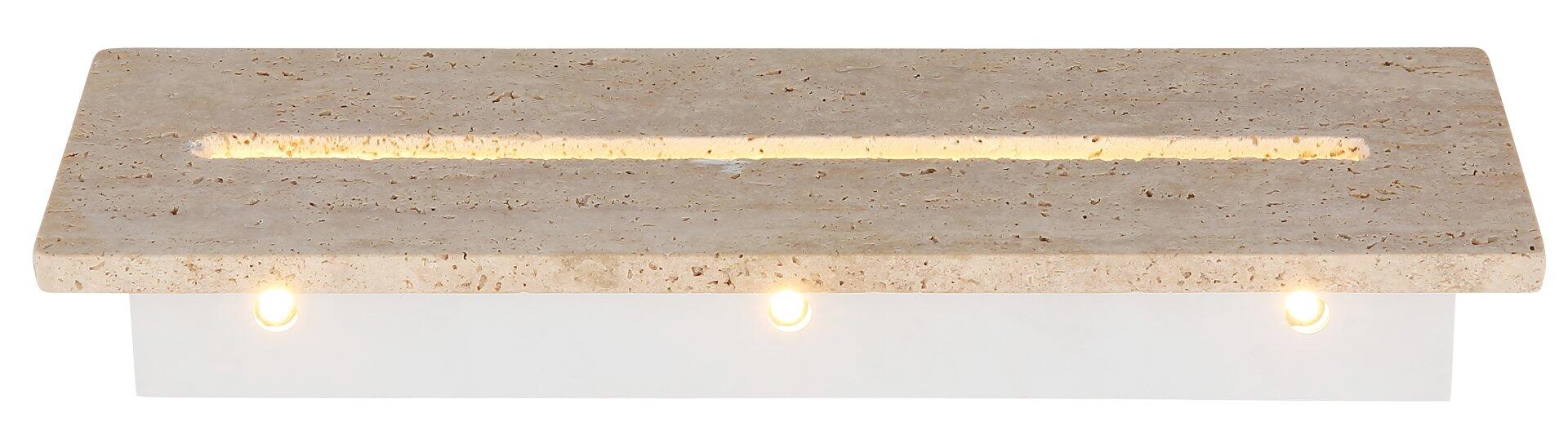 Wandleuchte ROJAS mit Travertin-Glas, die im 45-Grad-Winkel von unten zeigt, wie ein Lichtschein nach oben und unten strahlt und die natürliche Maserung des Steins beleuchtet.