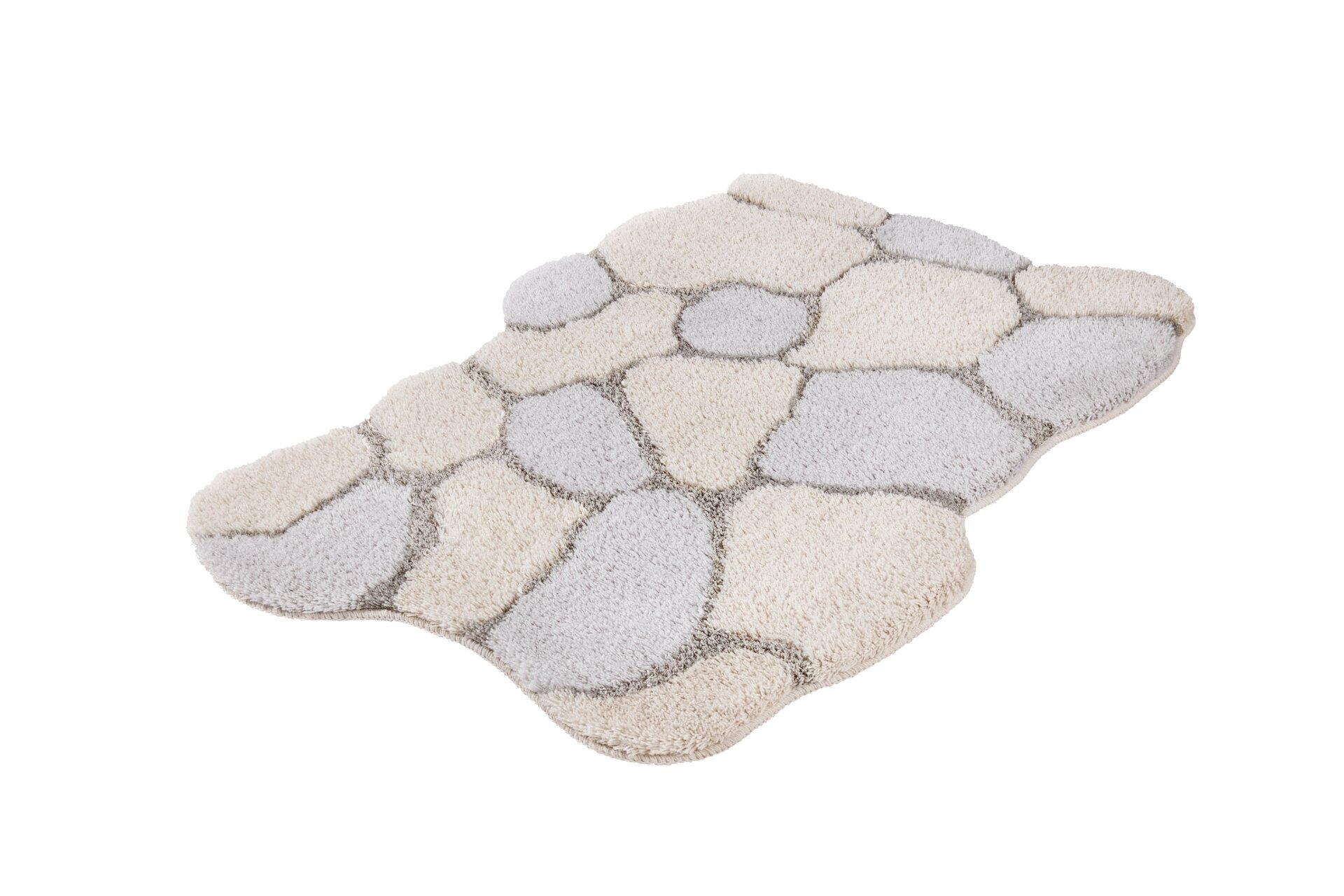 Badteppich Brick aus Seide mit organischem Design in Beige und Silbergrau, dargestellt in einer erhöhten Perspektive, die die Textur und die dreidimensionale Form betont.