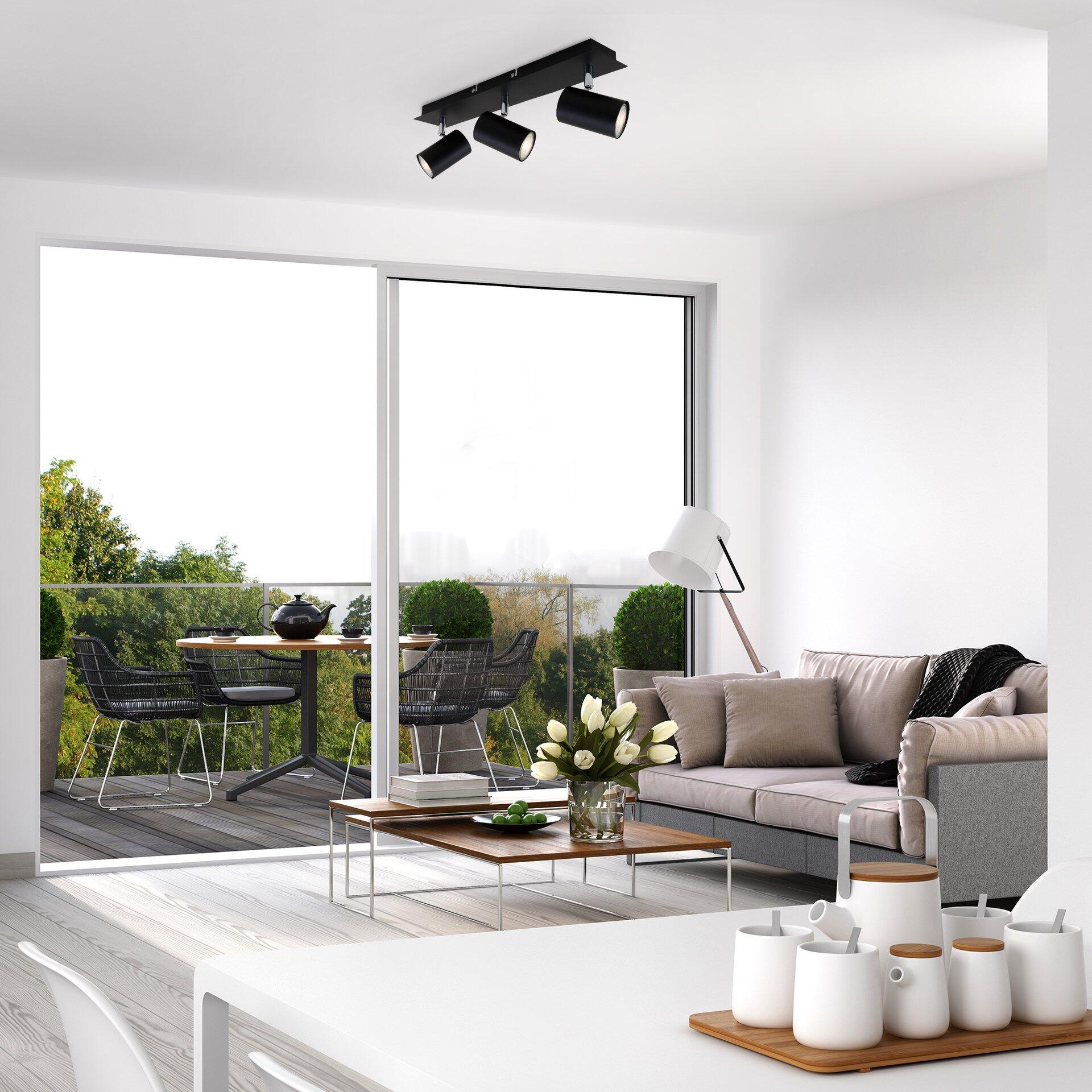 Spot, Run - Weißes BRILO Couchtisch mit Holzschale und Tassen, detaillierte Nahaufnahme in einem modernen Wohnzimmer.