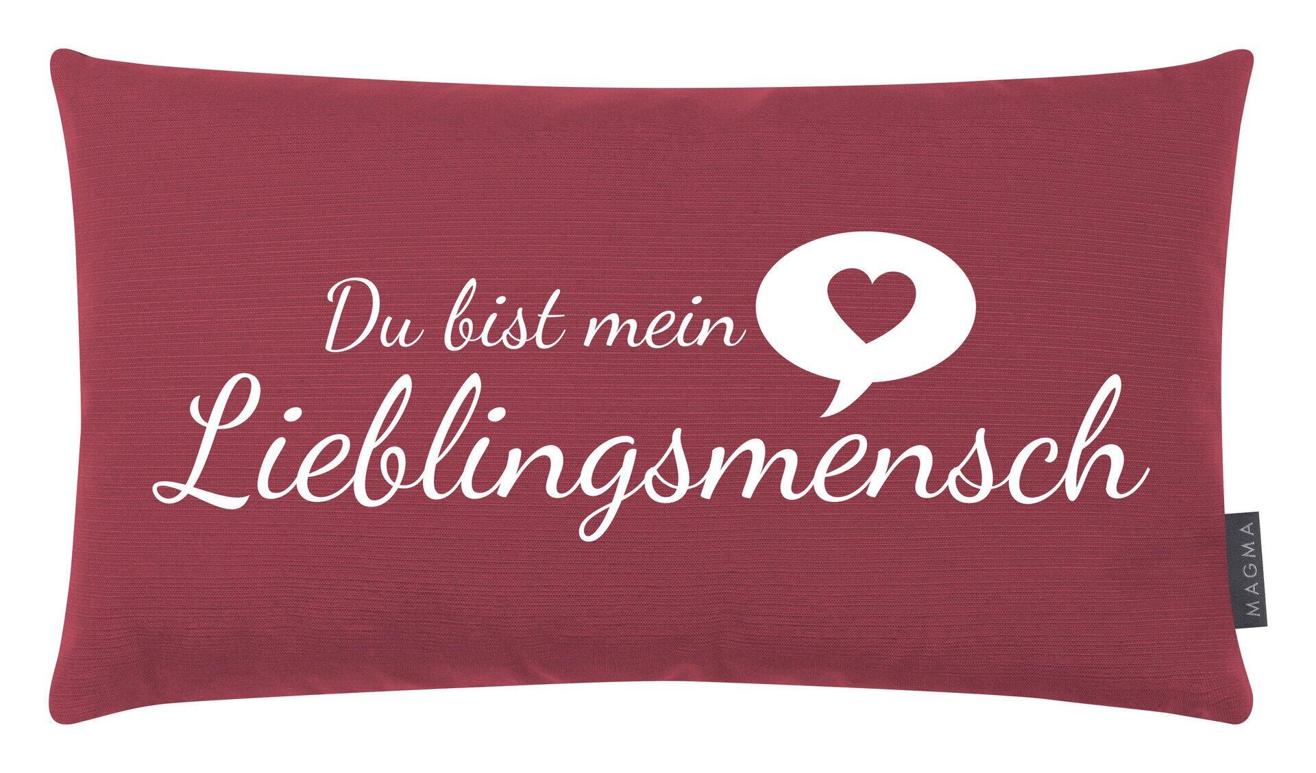Rechteckiges rotes Kissen mit weißem Aufdruck "Du bist mein Lieblingsmensch" und Herz.