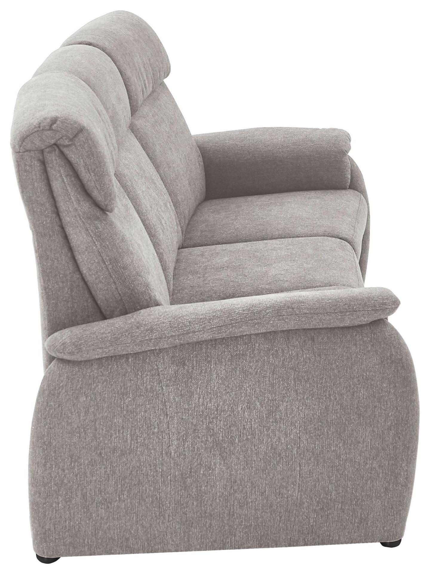 Seitenansicht des grauen Trapezsofas 821 mit abgerundeten Armlehnen, leicht geneigter, gewölbter Rückenlehne und schwarzen Metallfüßen.