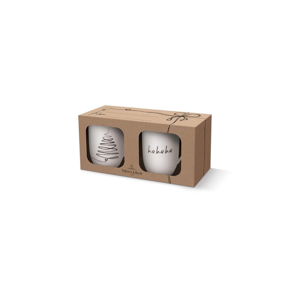 Villeroy & Boch XMAS Set Baum 2tlg. – Zwei weiße Tassen mit Baum-Design und "ho ho ho" Aufschrift in einer Geschenkverpackung.
