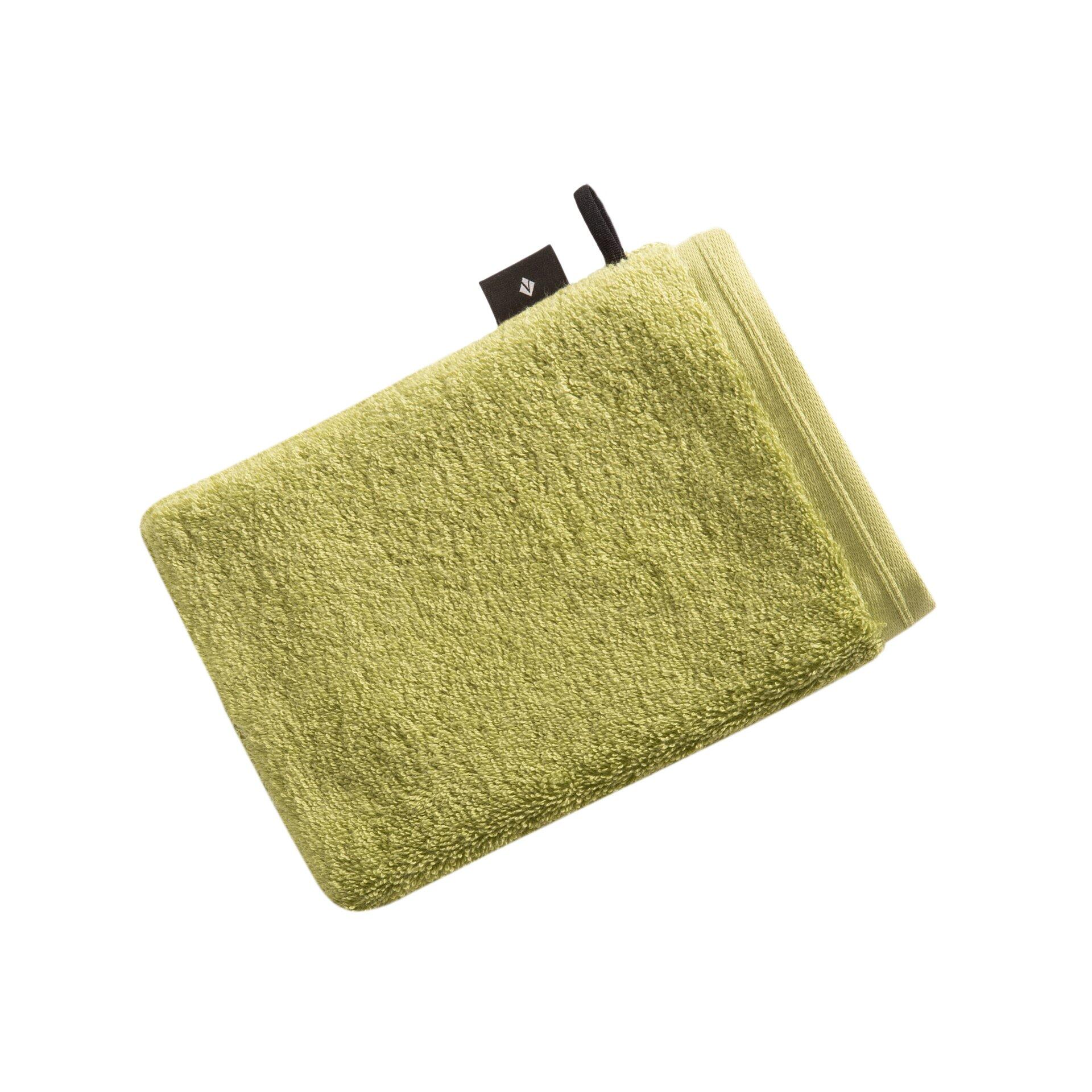 Flauschiger Vegan Life Waschhandschuh aus 100% Baumwolle mit strukturierter Oberfläche und Logo-Etikett auf weißem Grund.