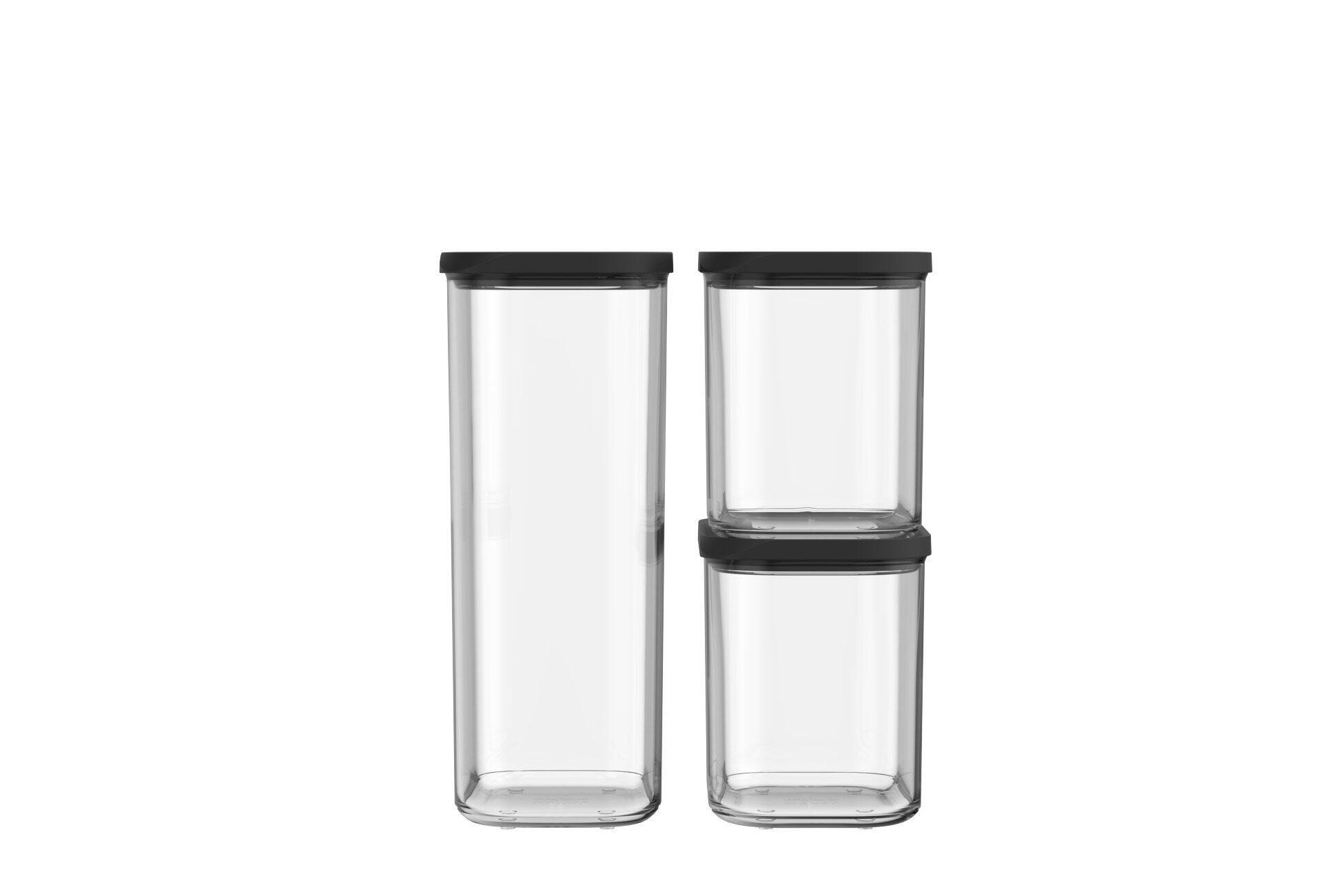 Starterset Dose Modula: Zwei transparente Vorratsgläser mit schwarzen Deckeln, das größere links, das kleinere rechts, im schrägen Blickwinkel dargestellt.