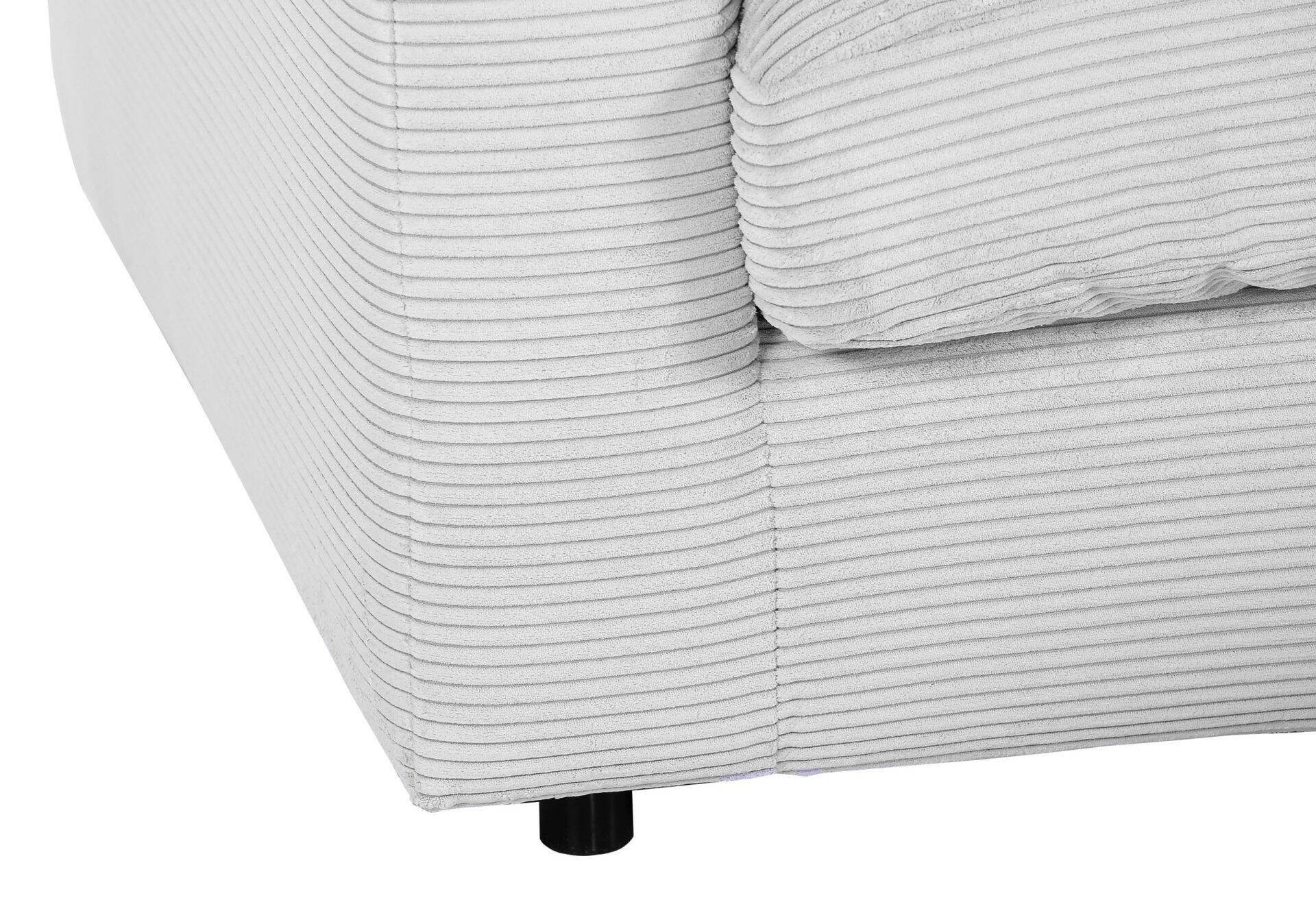 Graues Cord-Sofa mit Metallfüßen in Nahaufnahme.