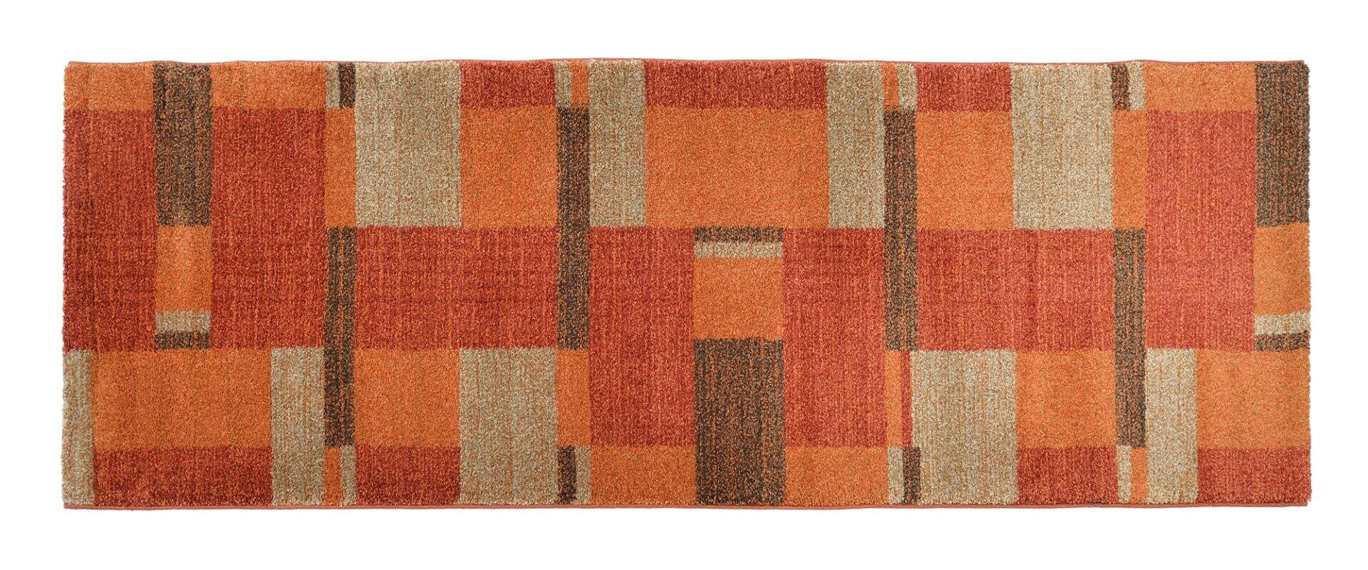 Maschinenwebteppich Salda mit geometrischem Muster aus rechteckigen Formen in Brauntönen und Beige, dargestellt in einer Draufsicht.