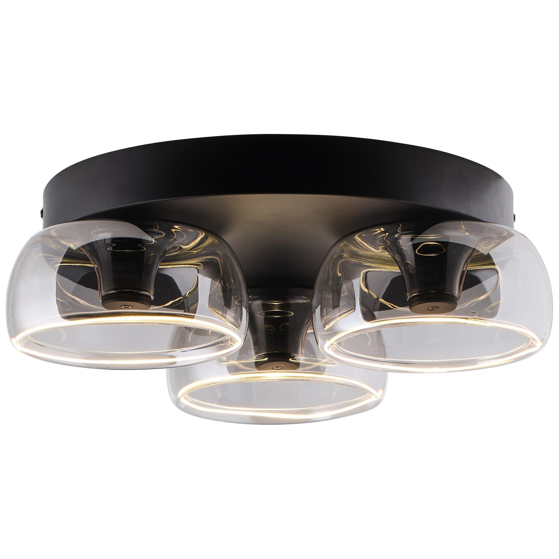 Deckenleuchte Phantom im Gegenlicht mit drei transparenten, halbrunden Lampenschirmen und warmweißen LED-Lichtstreifen.