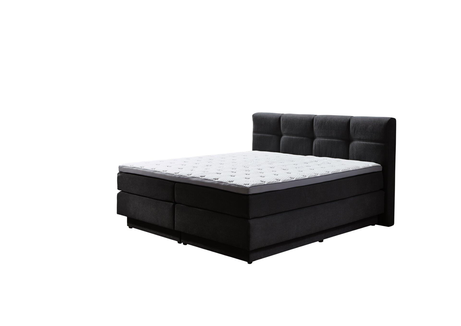 Boxspringbett Portage BX2110 mit dunkelgrauem Stoffbezug, gepolstertem Kissenkopfteil und integrierten Schubladen im Bettkasten, aus der Seitenperspektive dargestellt.