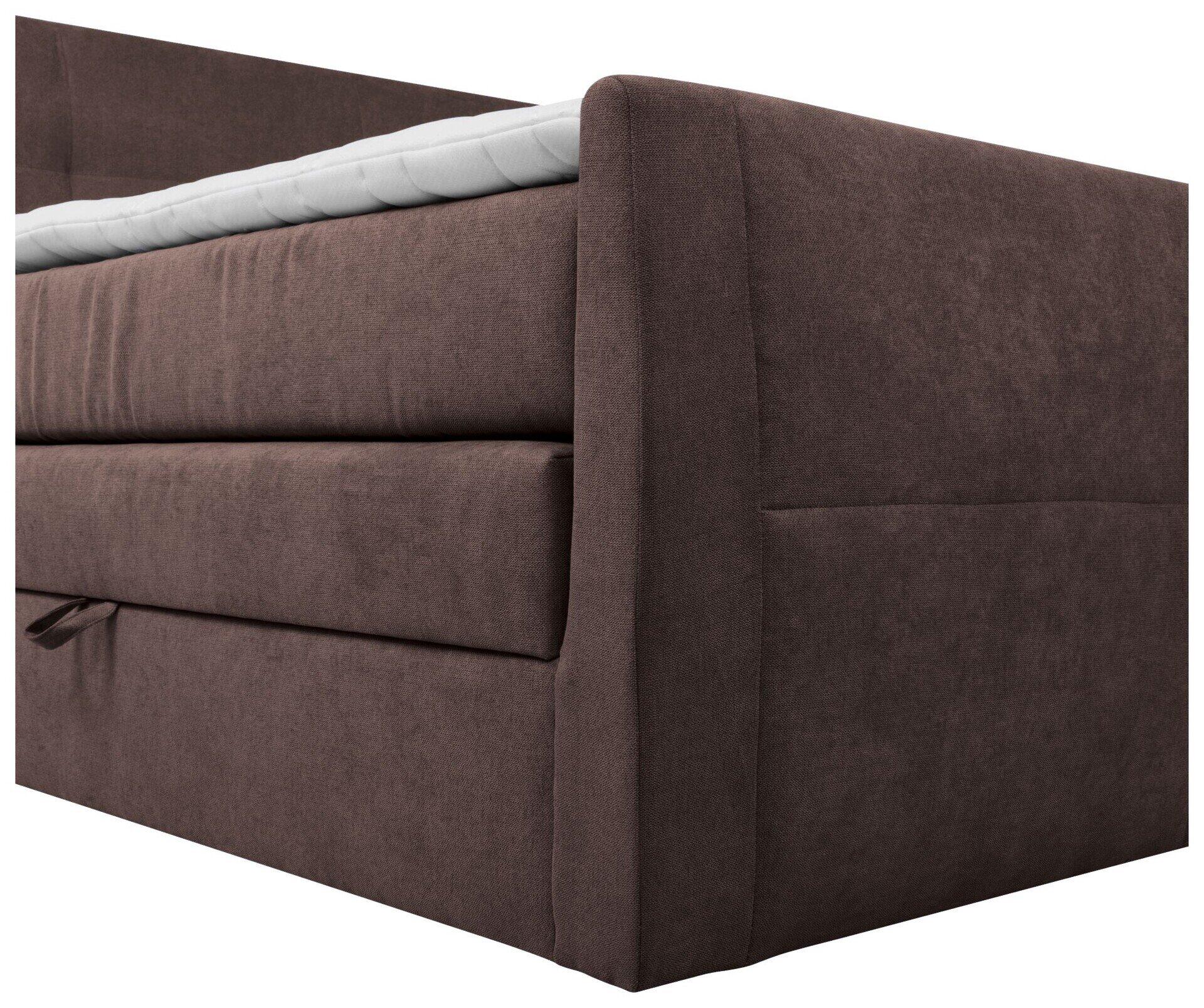 Detailaufnahme des Boxspringbettes Limos 2 mit seitlicher Ansicht des rechteckigen Gestells, das Bettkasten mit Innenstruktur und mehreren Fächern zur Aufbewahrung zeigt.
