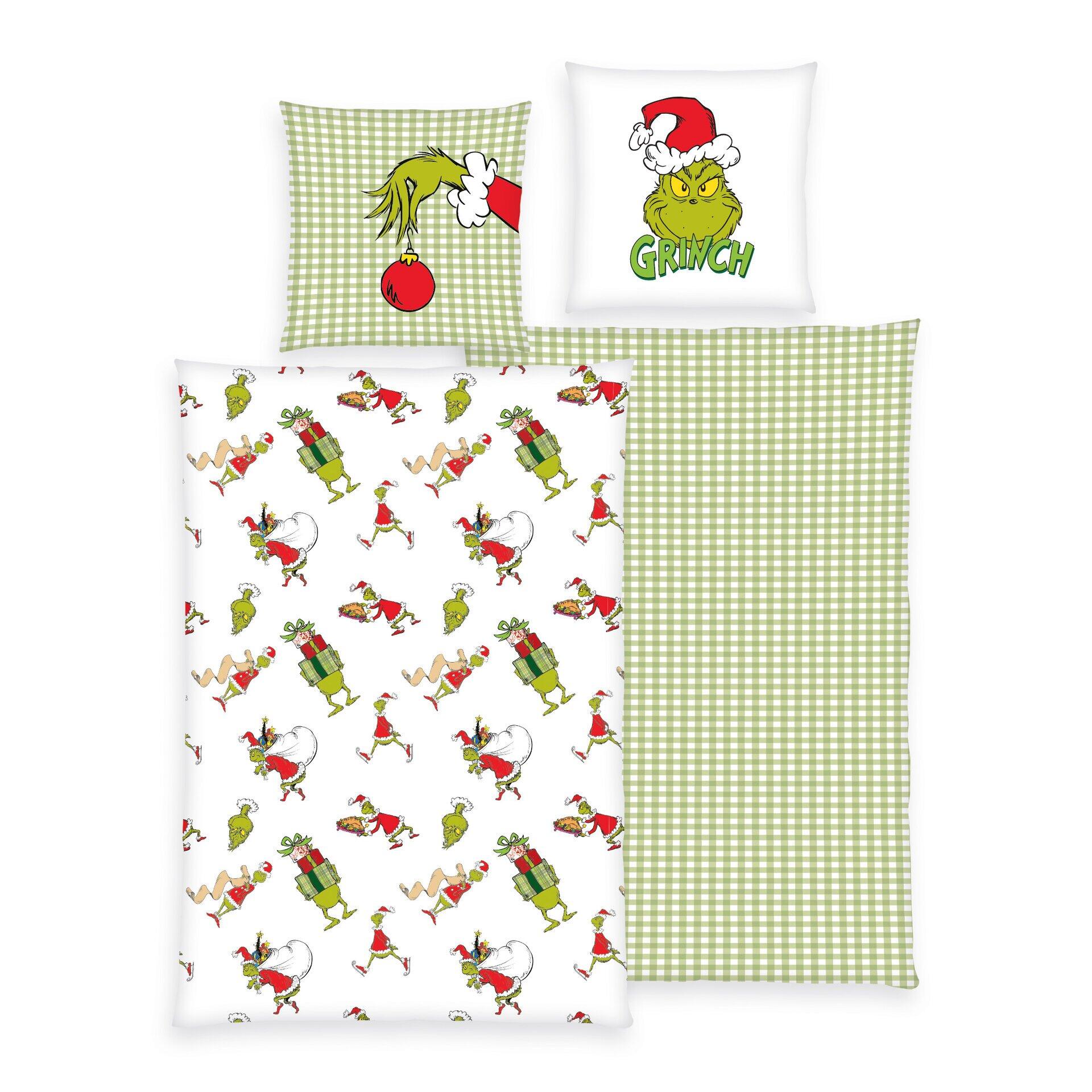 Bettwäsche Grinch: Kopfkissen mit Grinch-Motiv und roter Mütze vor hellem, kariertem Hintergrund.