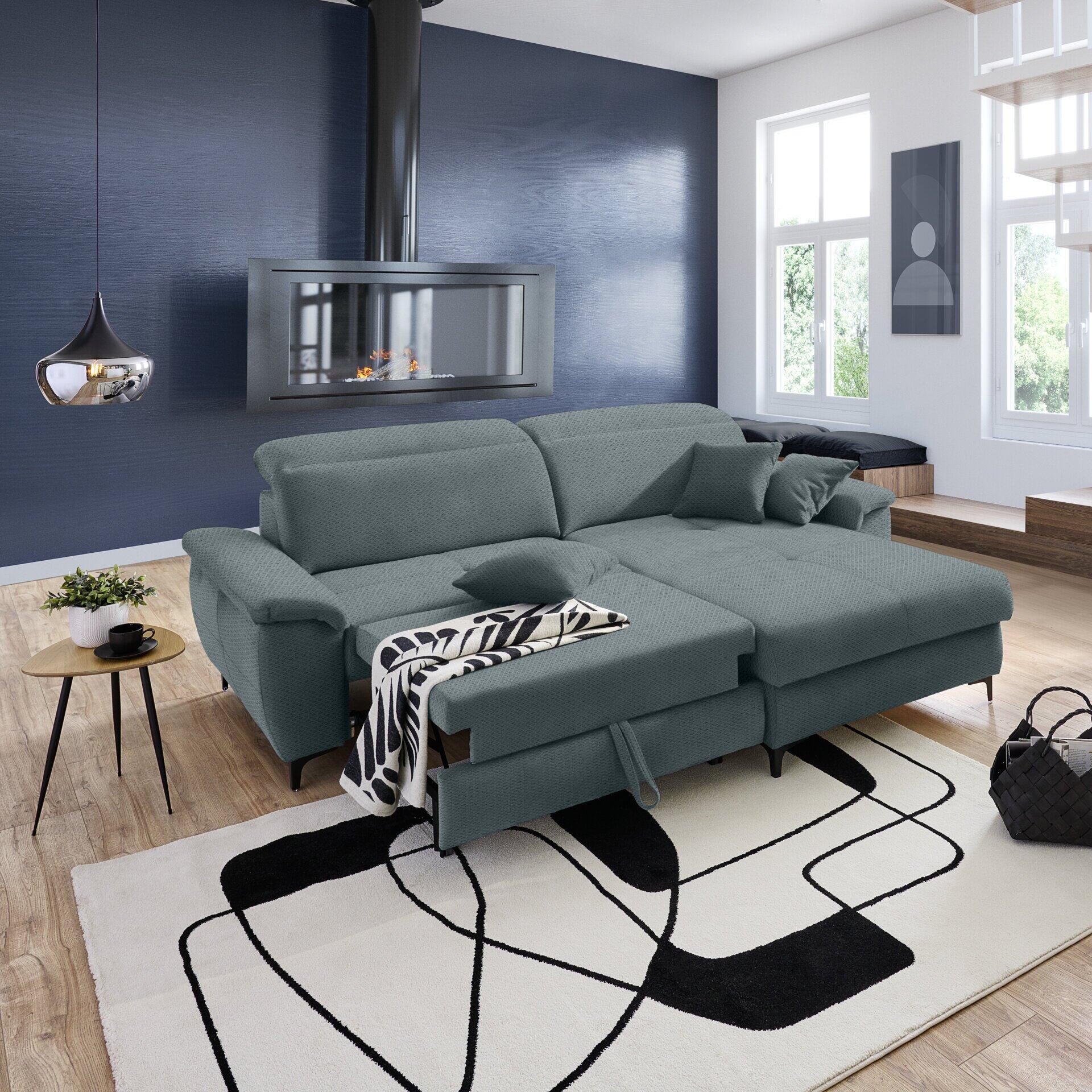 Ecksofa Retro in Grau mit ausgeklappter Schlaffunktion und abklappbarer Kopfstütze, präsentiert in einer erhöhten Perspektive im modernen Wohnzimmer.