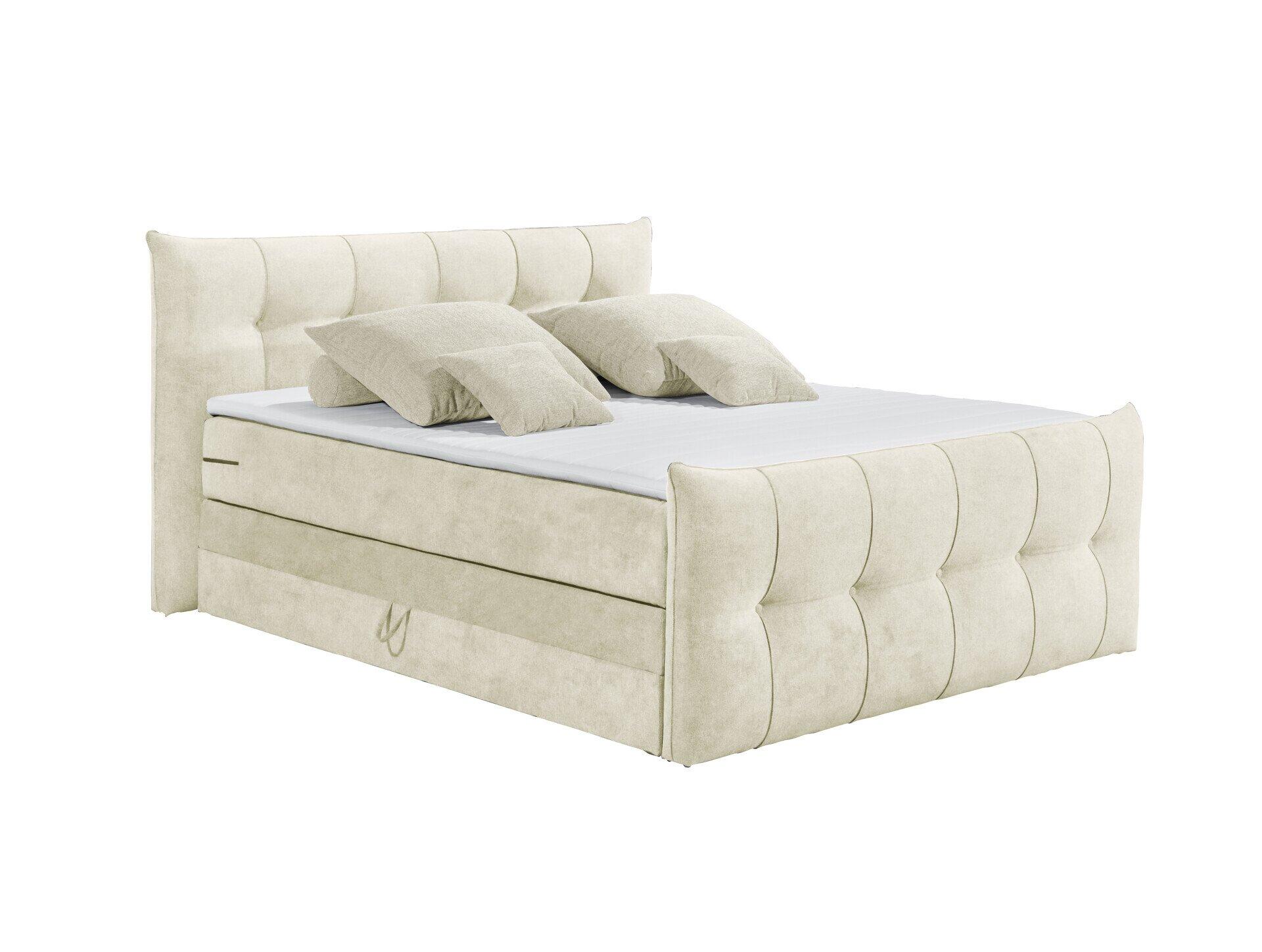 Boxspringbett Maracana 6 mit gepolstertem Kopfteil, Schubladenbereich und hellem Stoffbezug aus leicht schräger Frontansicht.