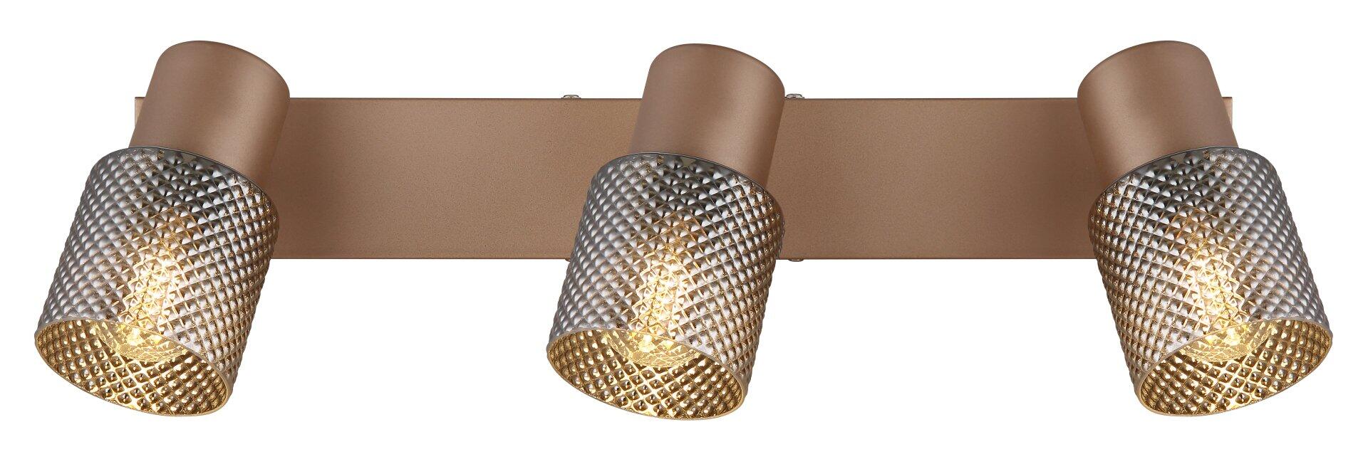 Dreifache Wandleuchte SATELLA mit anthrazitfarbenem, rechteckigem Korpus und drei zylindrischen Lampenköpfen mit geometrischem Muster und goldener Innenfläche, die einen warmen Lichtschein erzeugt.