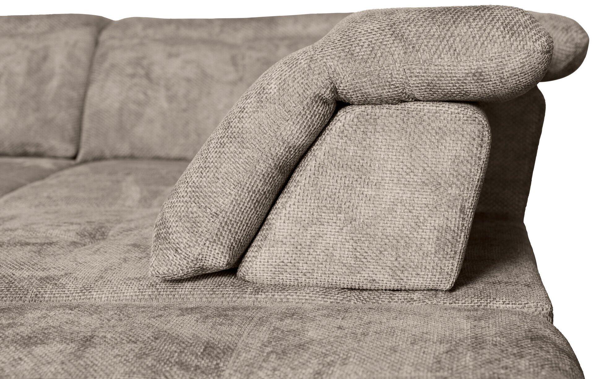 Graues Sofa mit gewellter Textur und abgerundetem Armteil.