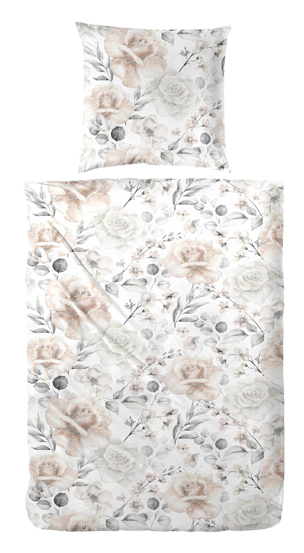 Bettwäsche-Set mit braun-weißen Blumenmuster und zarten Rosenmotiven auf einer Bettdecke und einem Kissen, aufgenommen aus Vogelperspektive.
