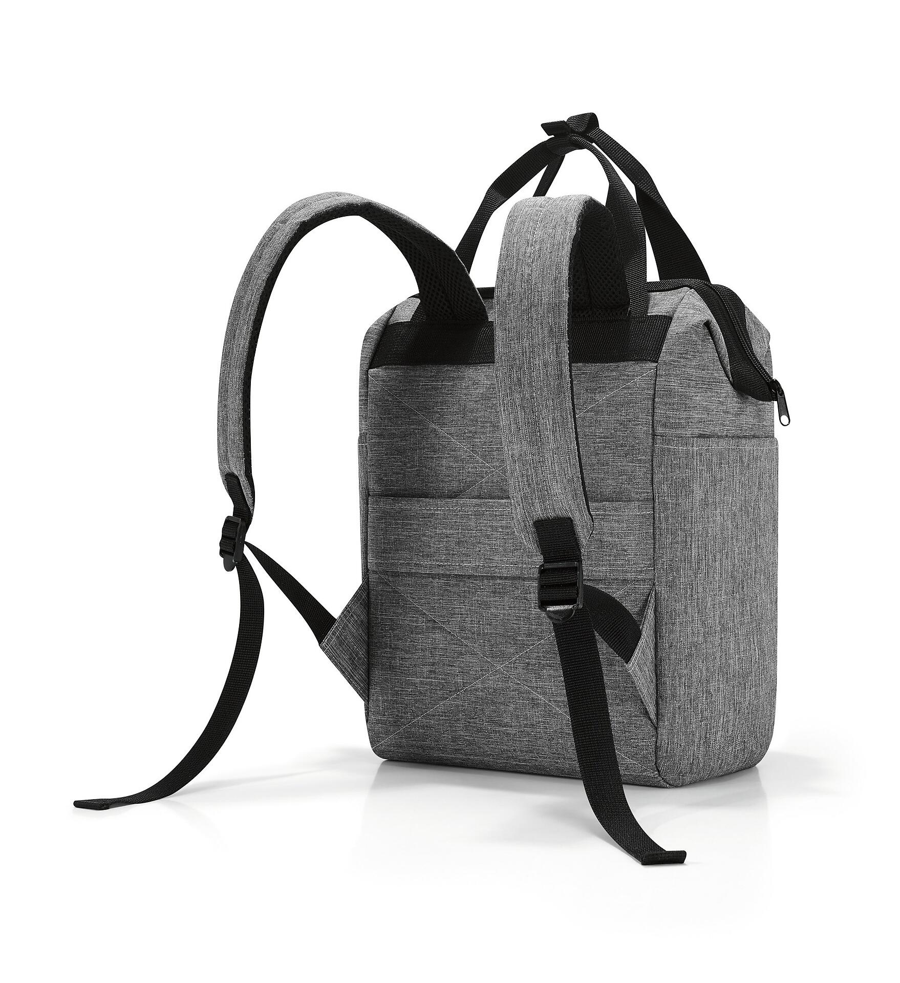 Grauer Allrounder r Rucksack mit strukturiertem Design und seitlicher Ansicht, die die rechteckige Form, die Tragegriffe, verstellbaren Schultergurten und ein seitliches Reißverschlussfach zeigt.