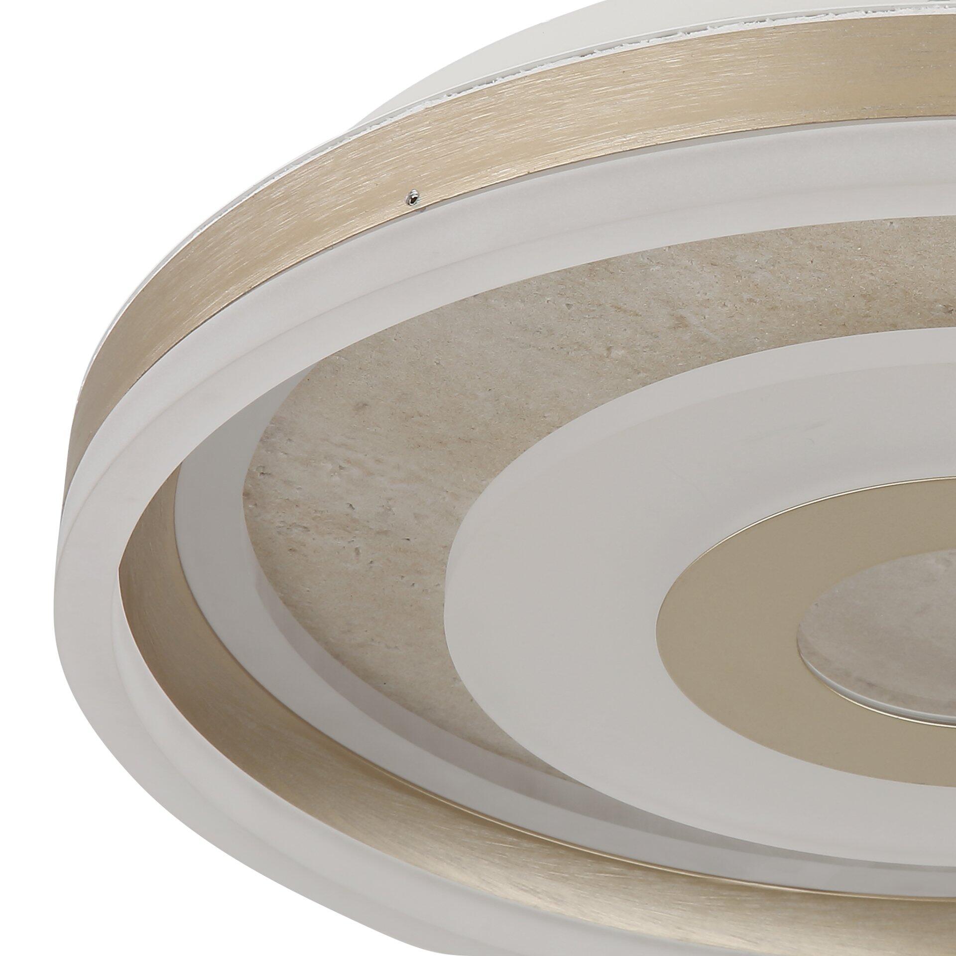 Nahaufnahme der Deckenleuchte CARDENAS mit konzentrischen, goldenen und weißen Ringen, die die metallische Struktur und die Form der Leuchte zeigen.
