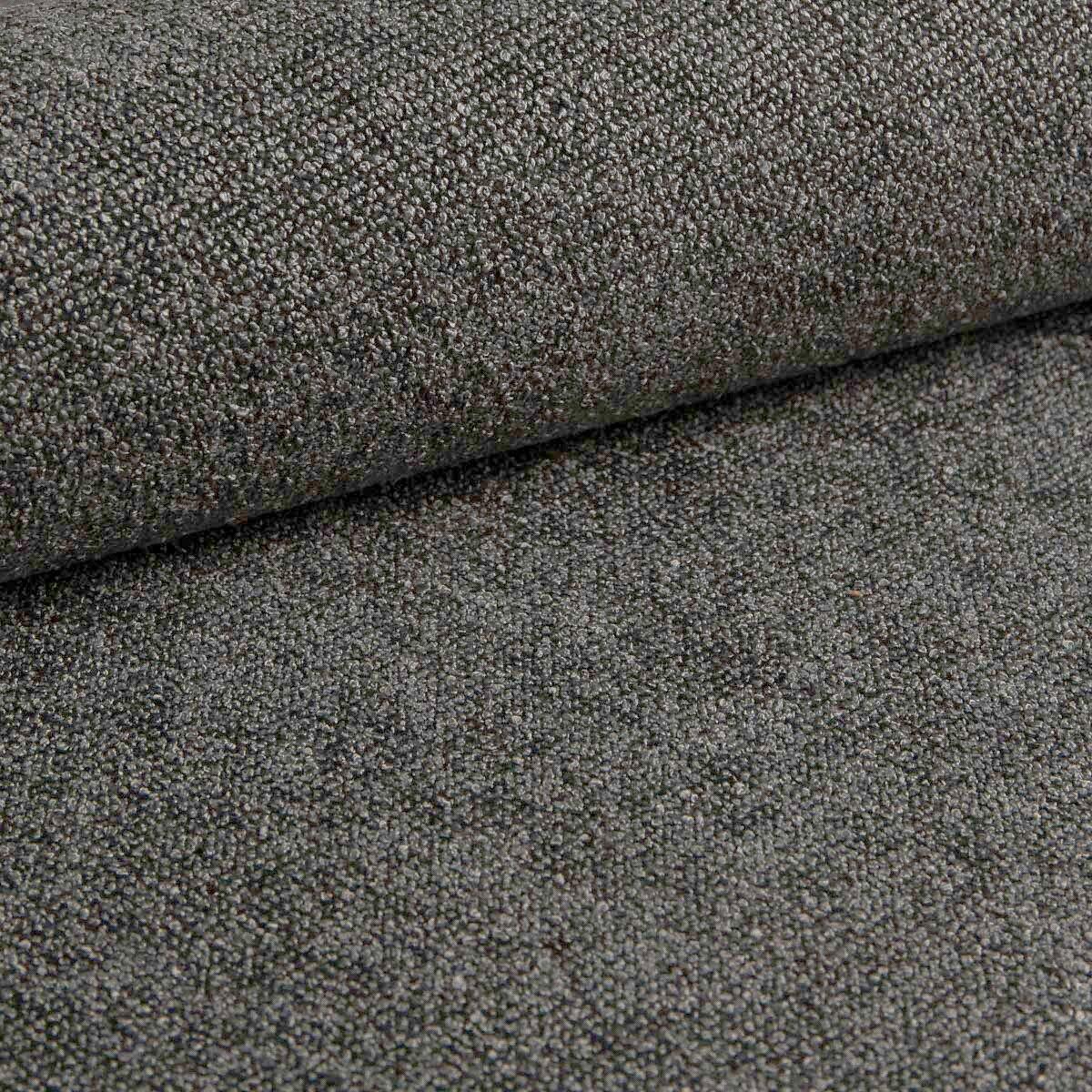 Detailaufnahme des grauen, gesteppten Stoffes des Boxspringbettes Castel mit rauer Textur.