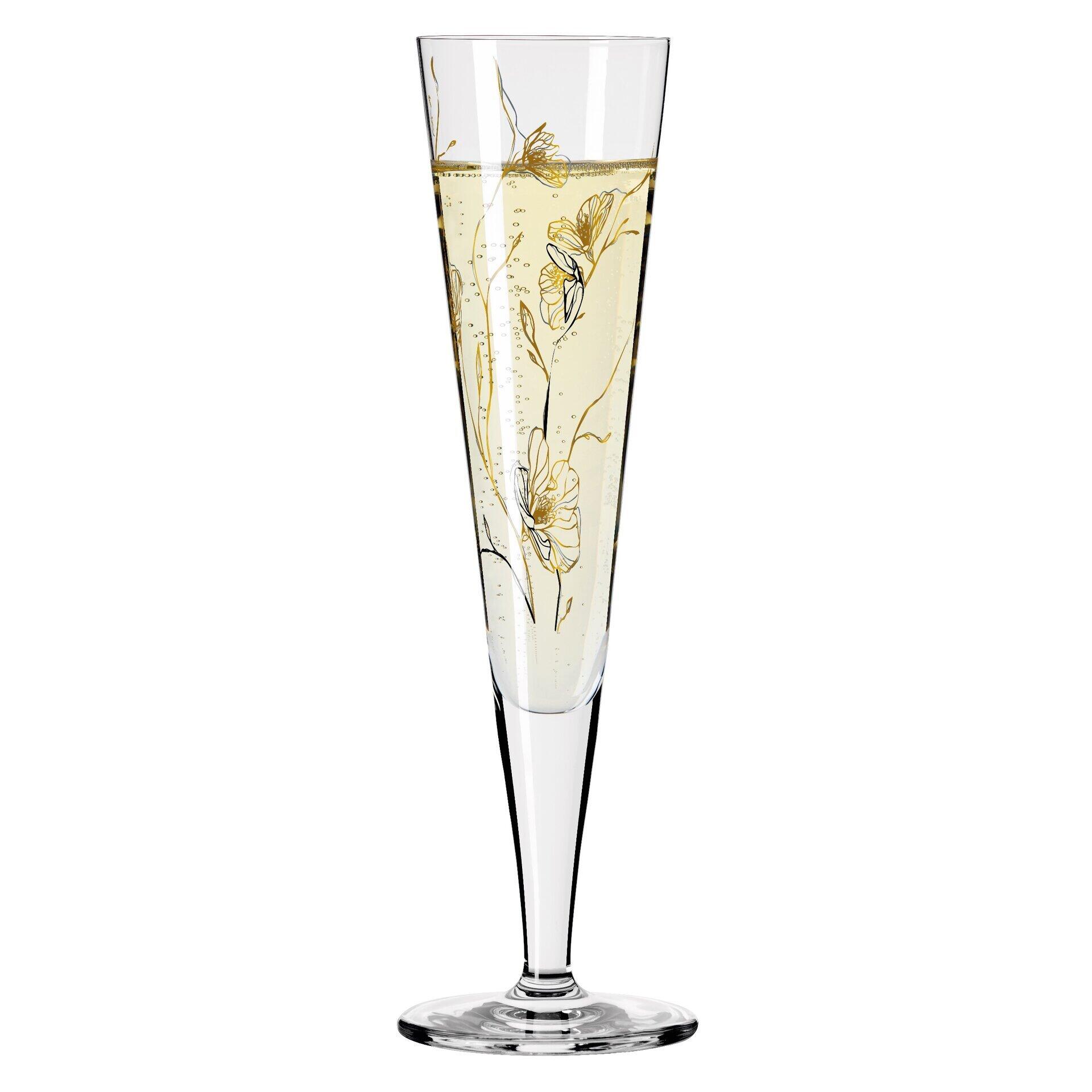 Champagnerglas mit langer, schlanker Tülle und goldenem Blütenmuster, gefüllt mit Champagner und auf einem schmalen Fuß stehend.