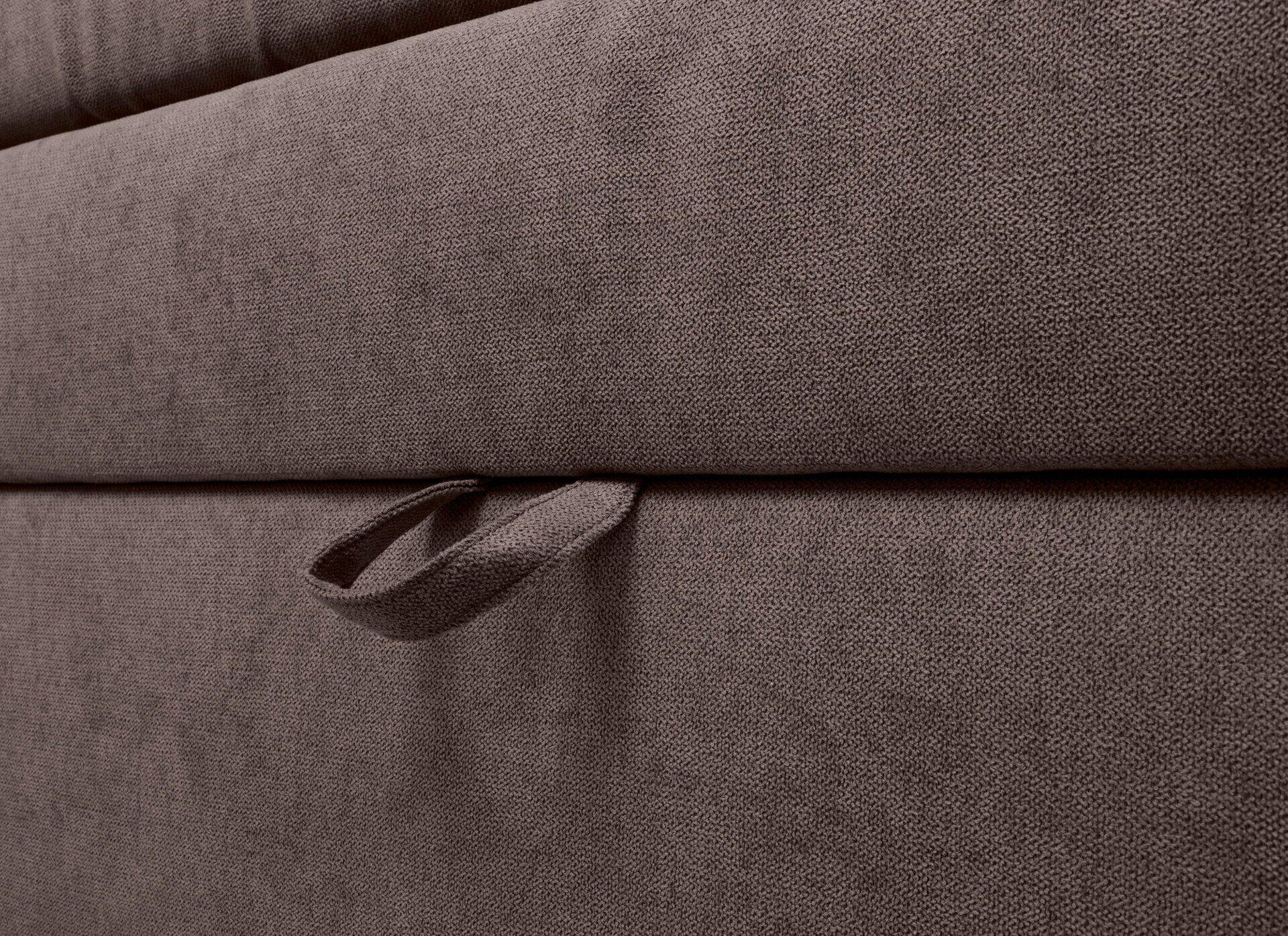 Detailaufnahme des Boxspringbettes Limos 2 mit gefalteter Stoffoberfläche und Griff zur Öffnung des integrierten Stauraums.
