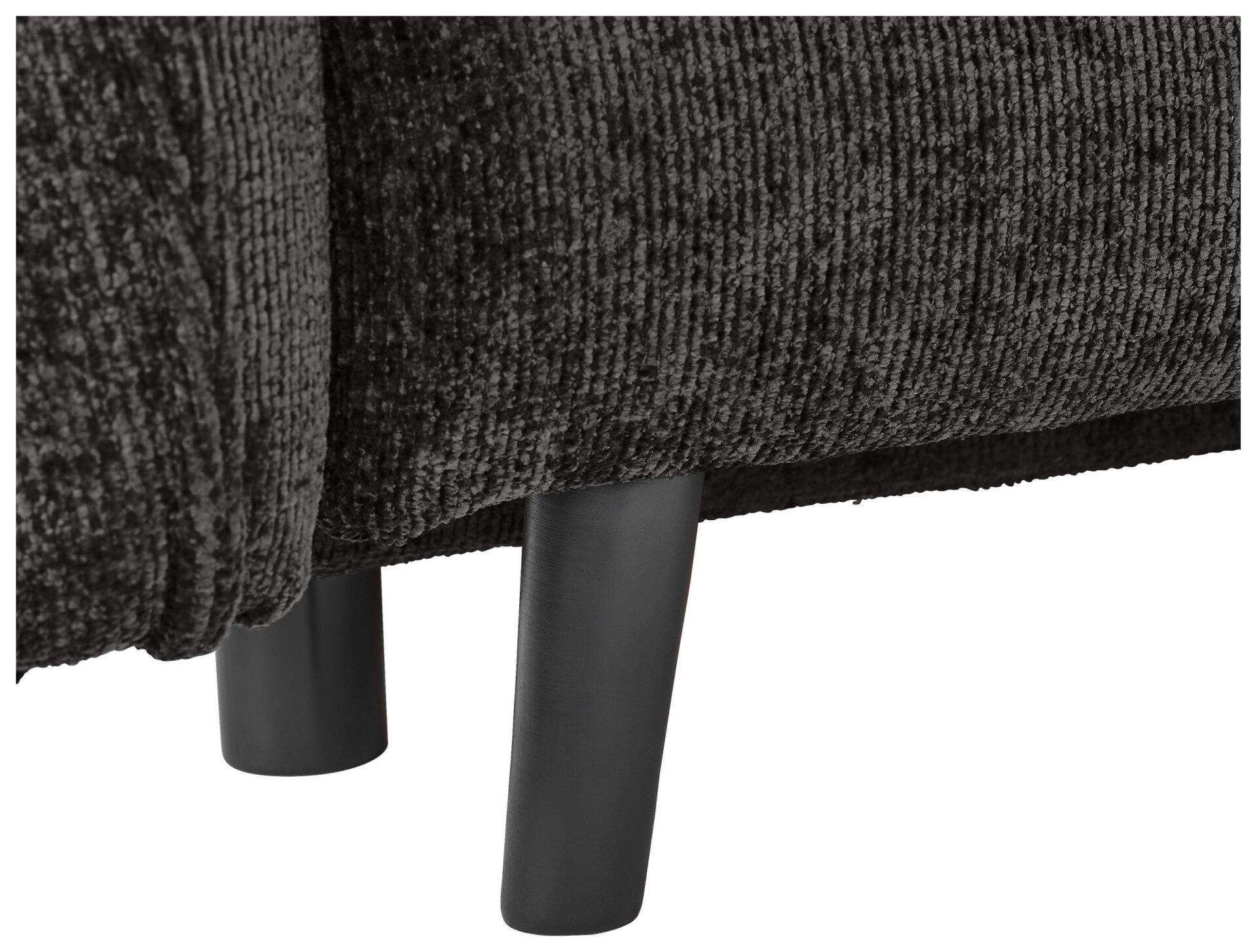 Detailaufnahme der konischen, schwarzen Füße des Sofas Santana mit strukturiertem Stoffbezug.