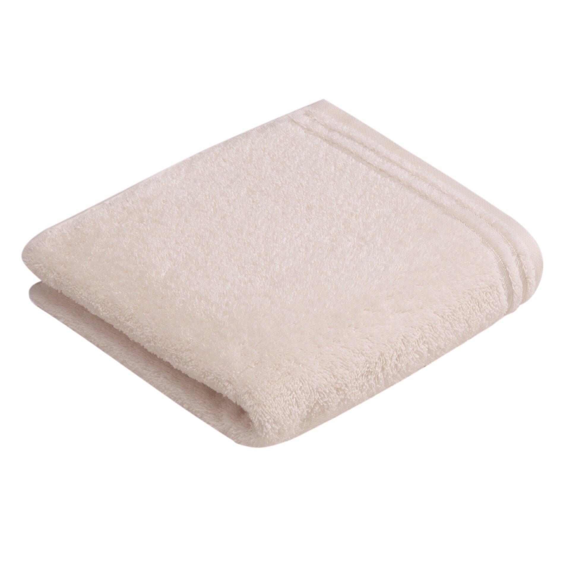 Handtuch Calypso Feeling, hellbeige Baumwollhandtuch in quadratischer Form, aus der Vogelperspektive fotografiert, um die weiche Textur und dicken, fluffigen Ränder zu zeigen.