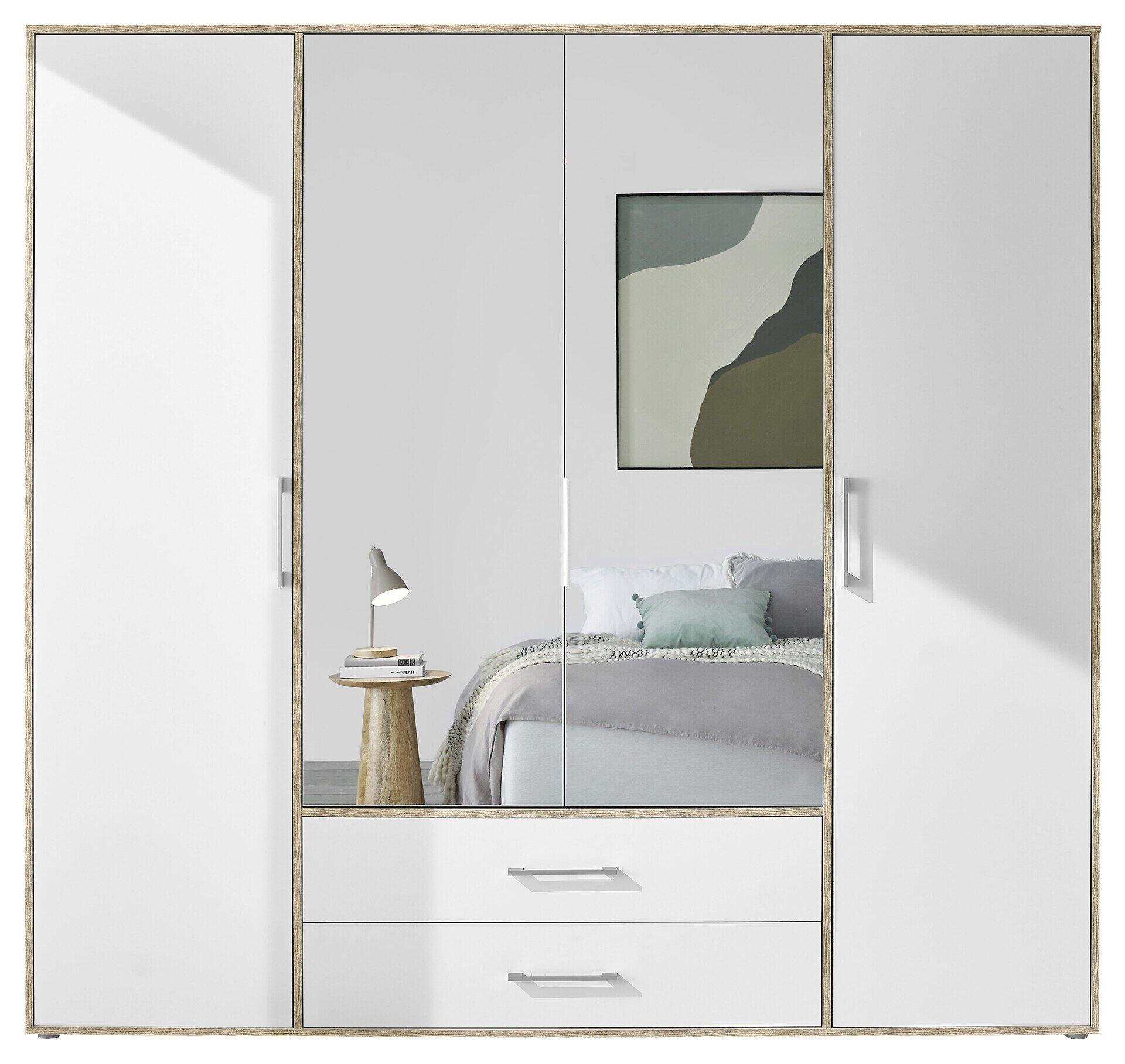 Weißer Kleiderschrank mit Spiegel und Blick auf ein schlicht eingerichtetes Schlafzimmer.