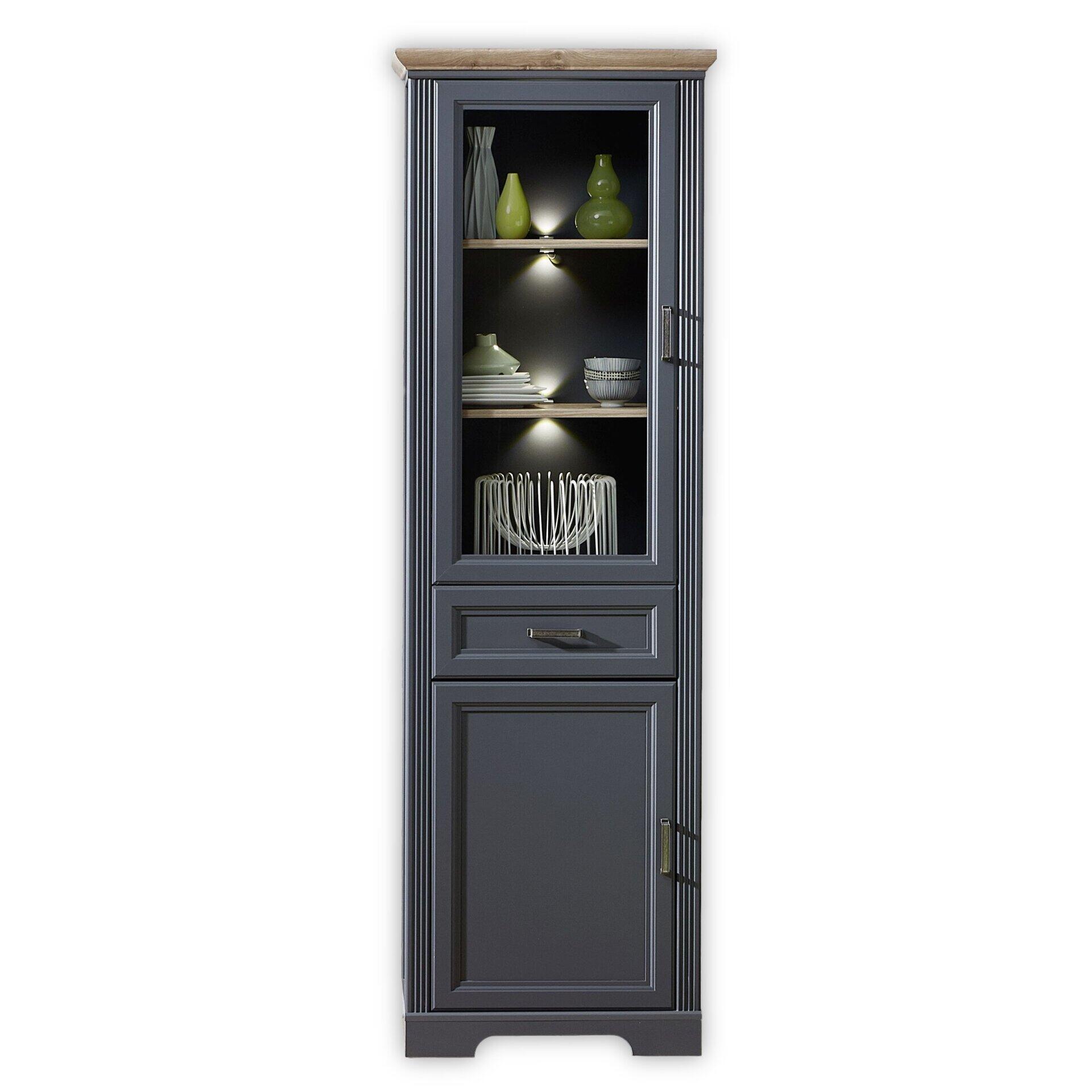 Vitrine Jasmin mit Anthrazitgrauem Korpus, dekorativer Holzoberkante, Glastür, Holztür und LED-Beleuchtung, die den oberen, offenen Bereich mit dekorativen Elementen beleuchtet.