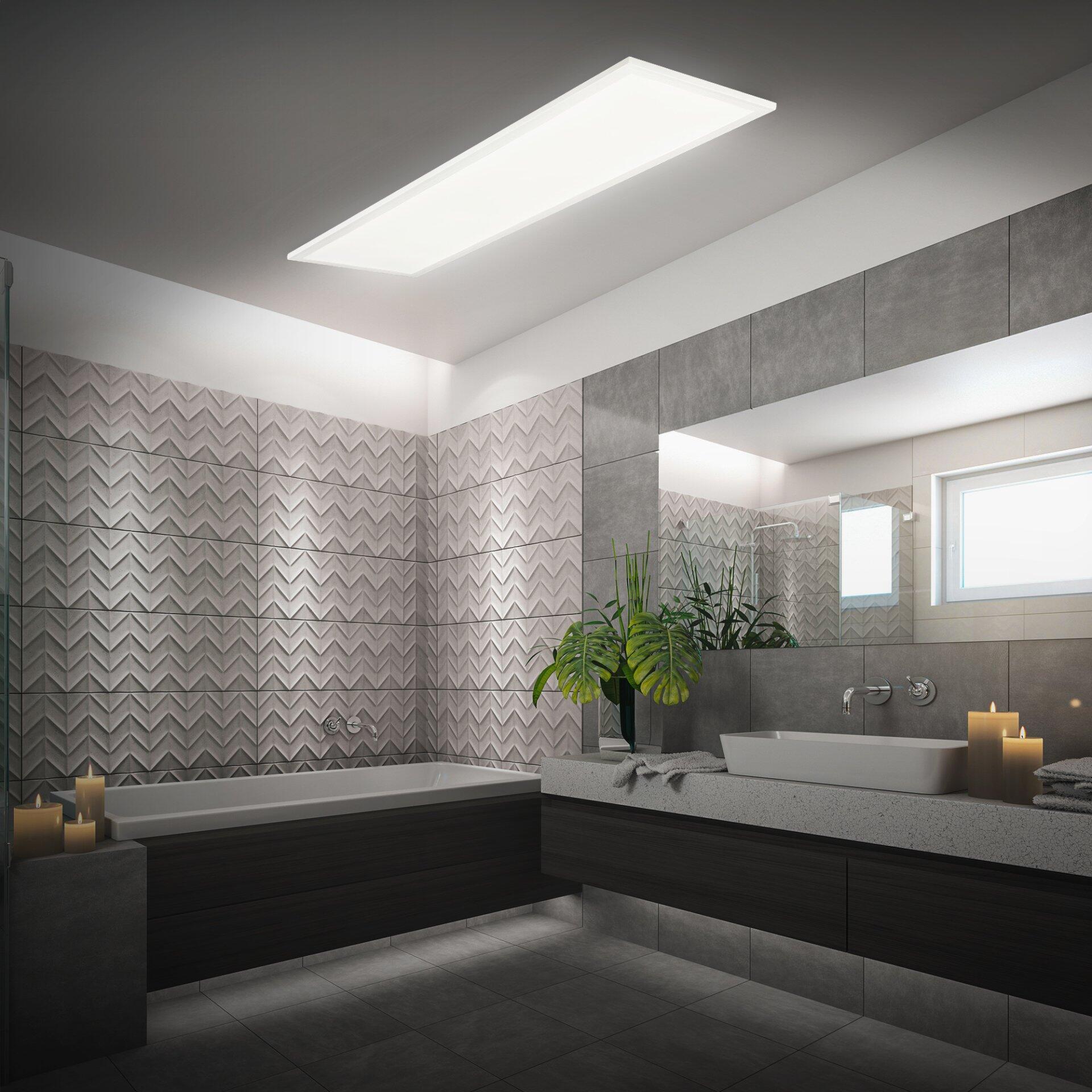Moderner, wandmontierter Waschtisch Piatto Panel mit Schubladen und integriertem LED-Licht, eingebettet in ein luxuriöses Badezimmer mit Eckbadewanne und geometrischen Fliesen.