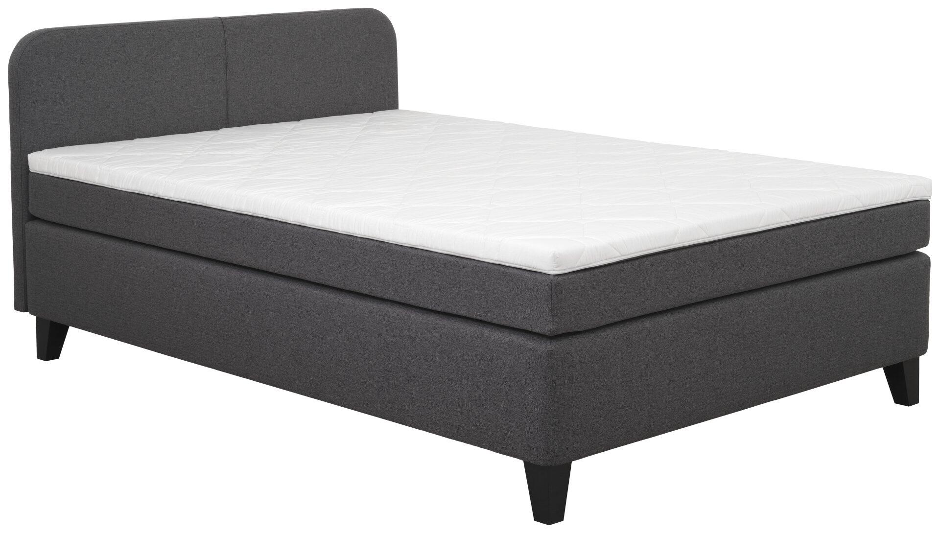 Boxspringbett Joliet BX2410 mit grauem Kopfteil, schwarzem Fuß und integriertem Bettkasten – seitliche Ansicht.