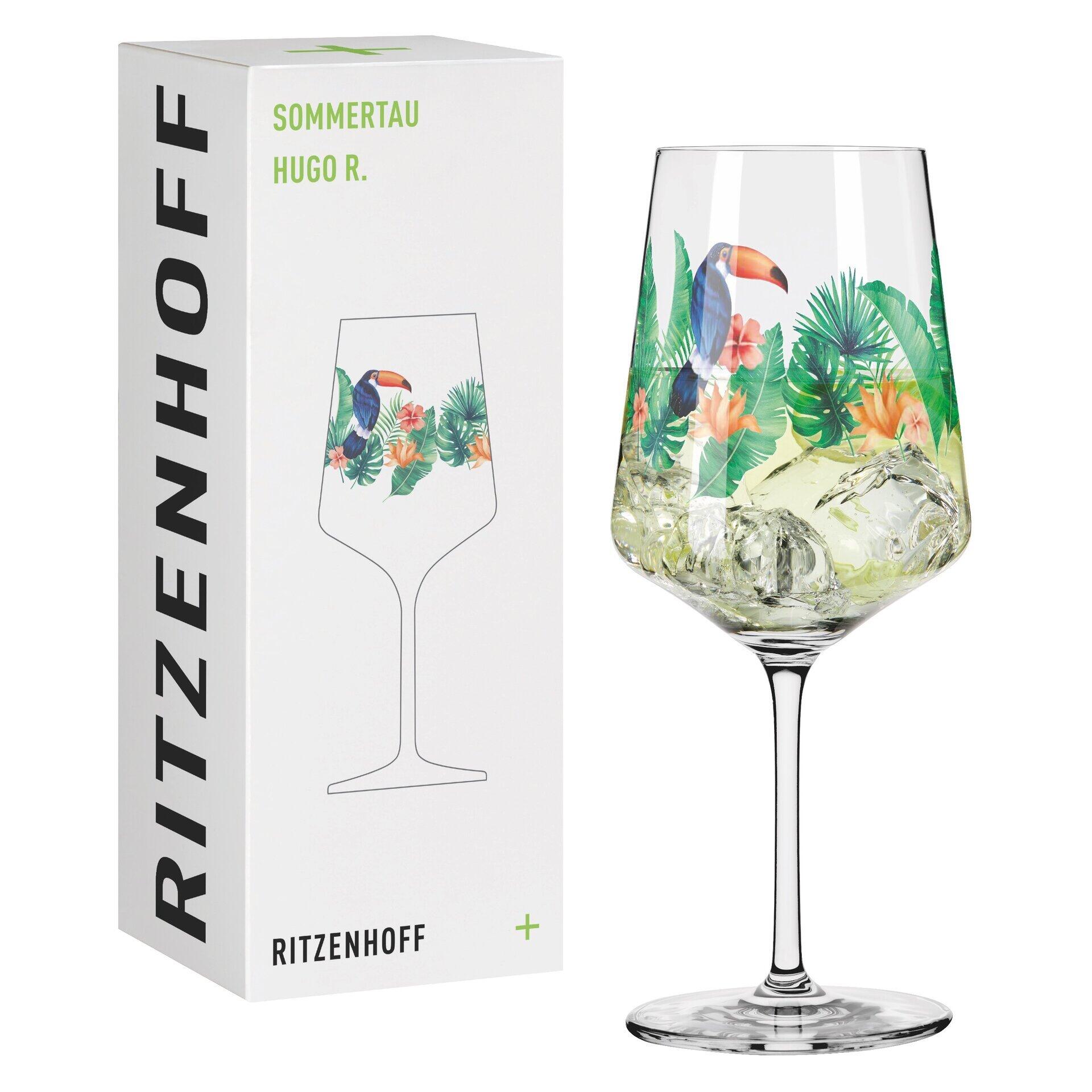 Tukan Aperitifglas mit detailliertem Motiv aus Tukan und tropischen Pflanzen, dargestellt in Frontalperspektive auf einer grünen Unterlage, inklusive Schemazeichnung.