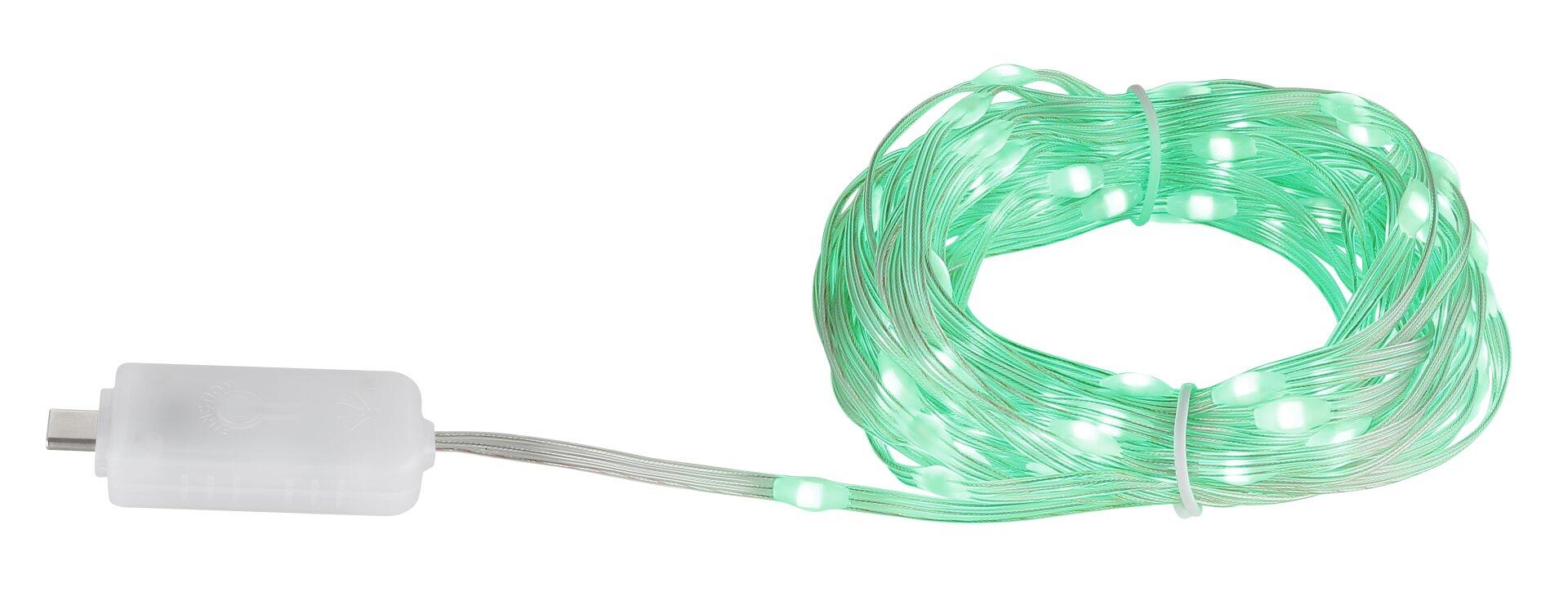 Aufgerollter LED-Band mit USB-C Anschluss und zahlreichen LEDs, die einen warmen Schein abgeben.