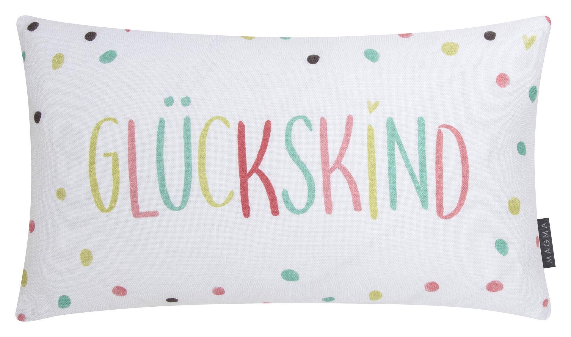 Kissen Glückskind mit buntem Schriftzug und Punkten in Frontalperspektive.