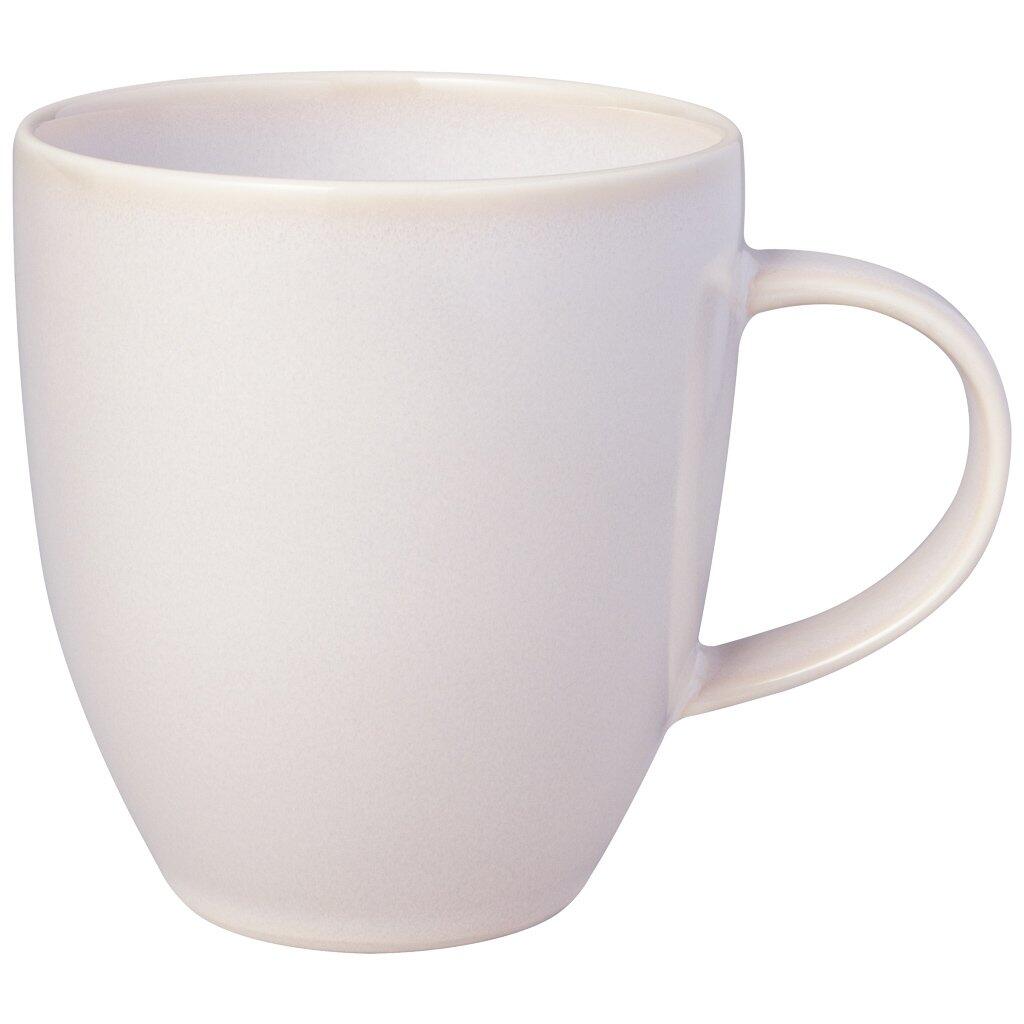 Becher mit Henkel Crafted Cotton, rund geformt, mit schmalem, elegant geschwungenem Henkel und leicht konischer Form, dargestellt in einer dreiviertelperspektive.