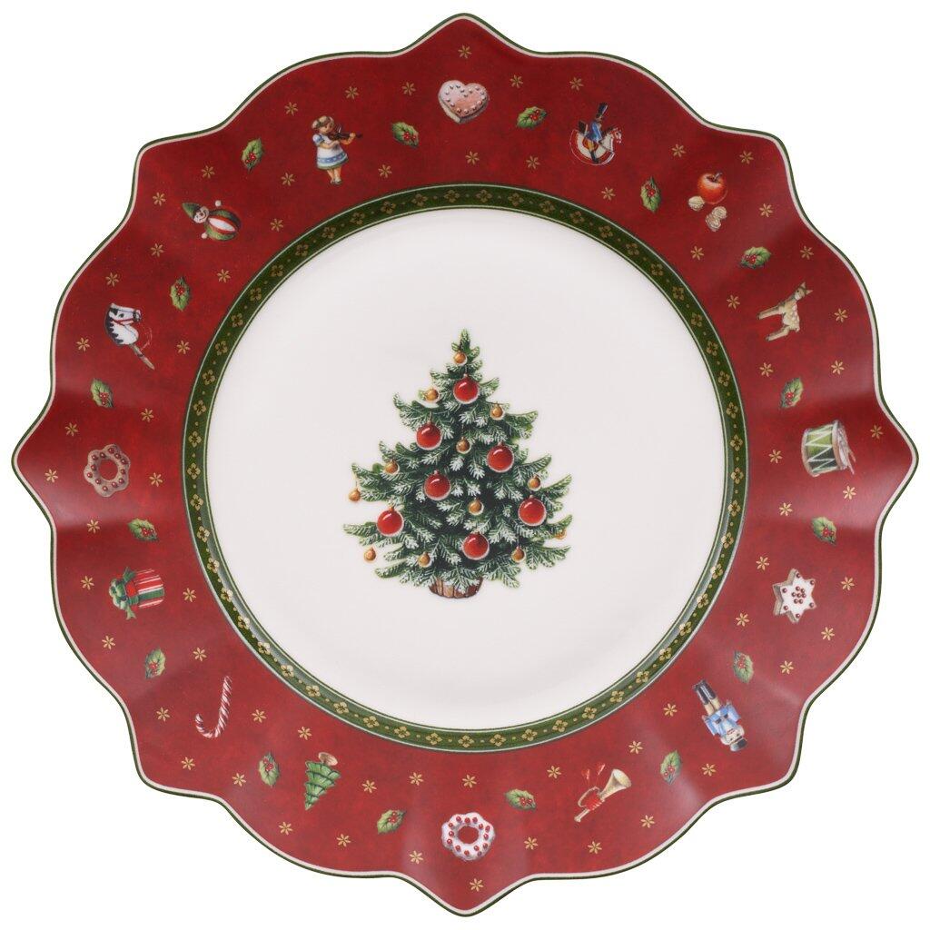 Weihnachtliche Tellerplatte rot von Villeroy & Boch mit gewelltem Rand und dekorativen Motiven wie Tannenbaum, Geschenke und Weihnachtsmänner, aus der Vogelperspektive dargestellt.