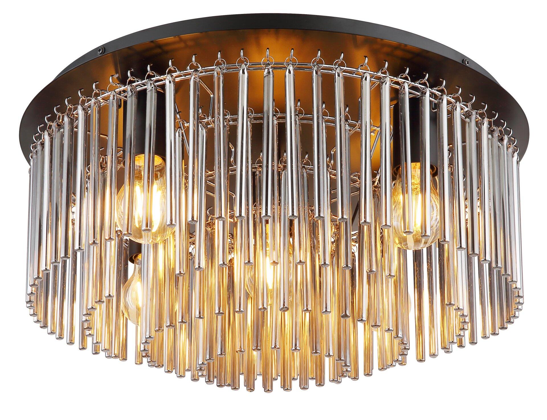 Deckenleuchte GORLEY mit filigranem Metallgestell aus gebogenen Silberstreben und rauchfarbenen Glaselementen, die einen warmen Lichtschein erzeugen.