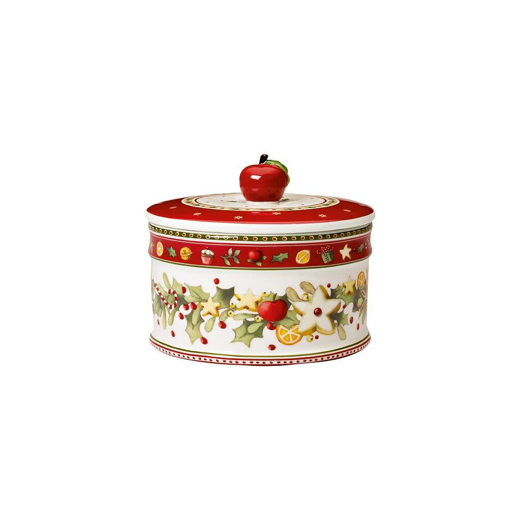 Gebäckdose Winter Bakery von Villeroy & Boch mit weihnachtlichem Dekor aus grünen Blättern, roten Beeren und weihnachtlichen Symbolen.