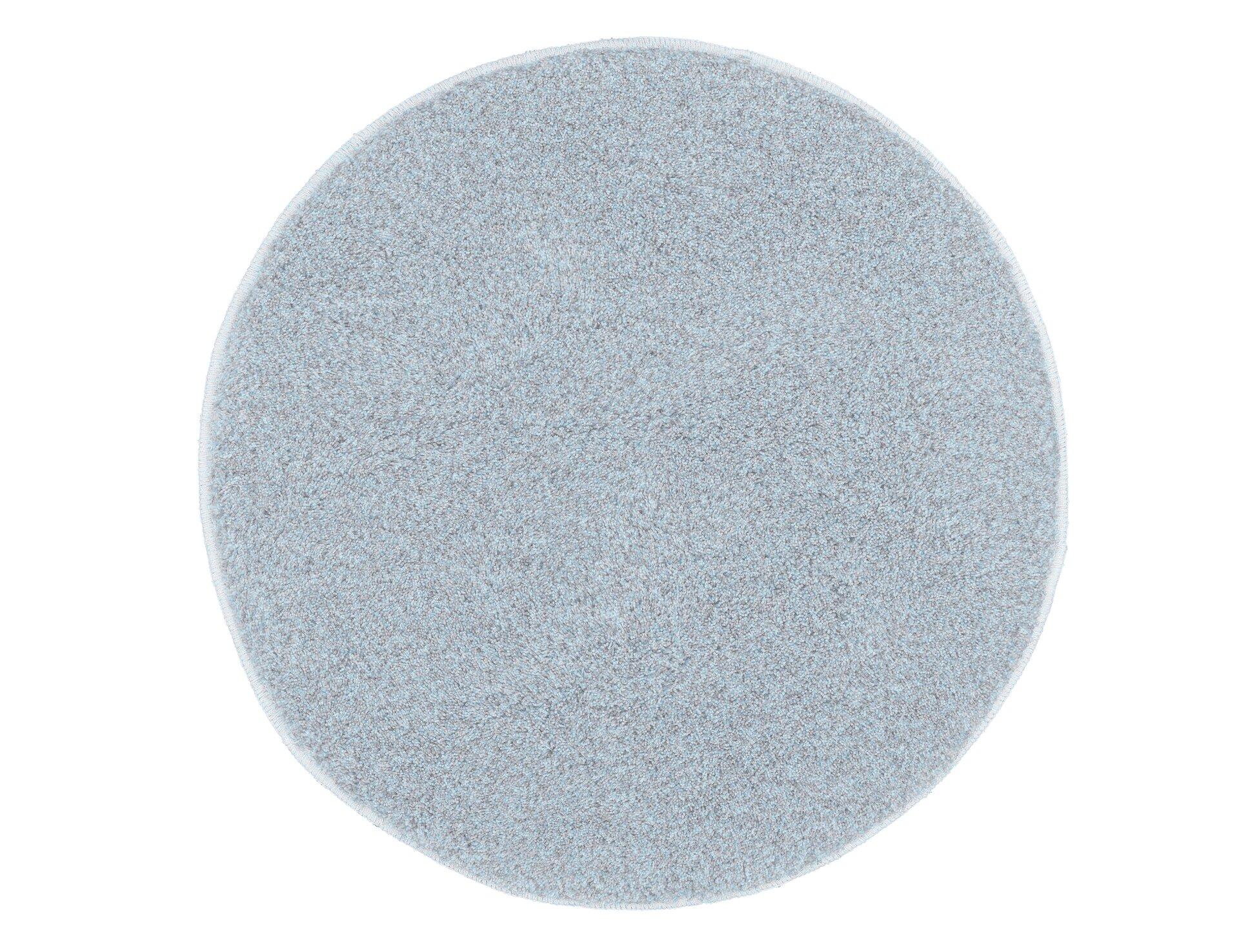 Stahlblauer Badteppich Relax mit runder Form und strukturierter Oberfläche, aus der Vogelperspektive.