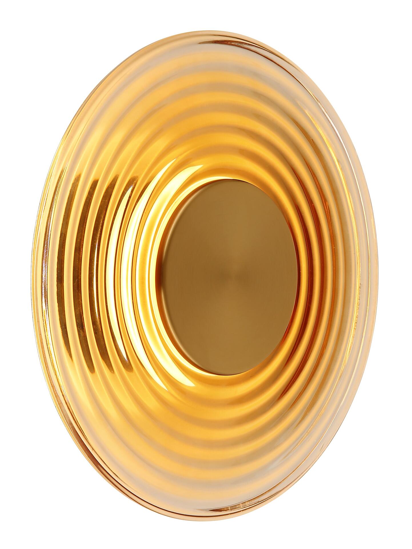Wandleuchte JANELL, goldfarbener Spiegel mit wellenförmiger Struktur in Draufsicht.