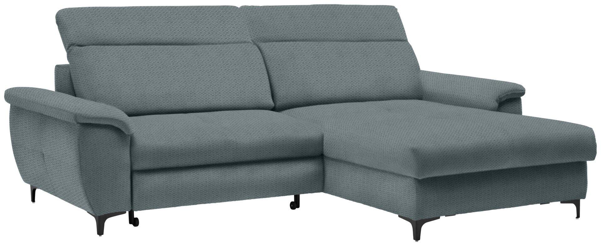 Graues Ecksofa im Retro-Design mit abklappbarer Kopfstütze und Bettkasten, abgebildet aus einer seitlichen Perspektive, die die geschwungene Rückenlehne, die Ottomane und die schwarzen Metallfüße zeigt.