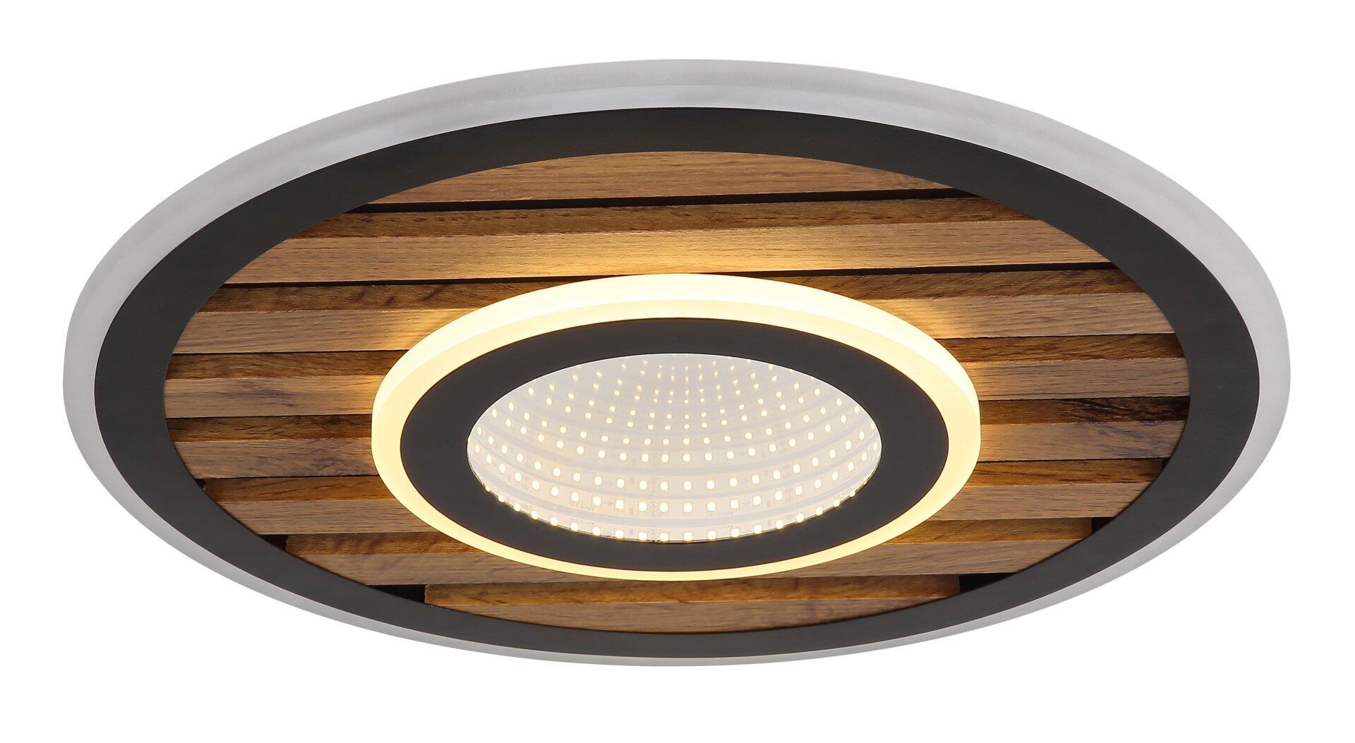 Deckenleuchte 67345D4 mit perforiertem Innenring, der ein warmes, diffuses Licht abstrahlt und durch den schwarzen Rahmen betont wird.