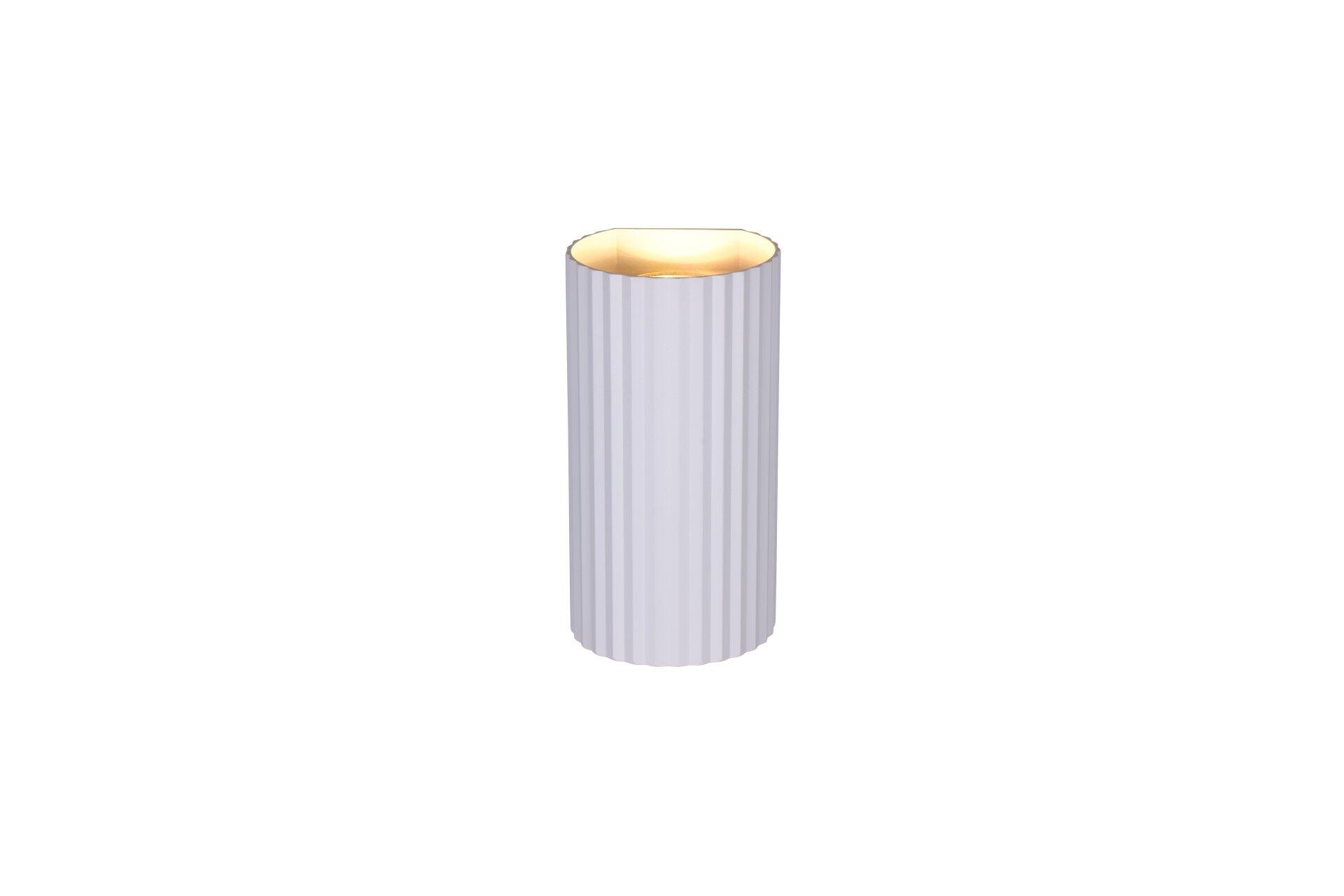 Wandleuchte Soka: Elegante, zylindrische Wandleuchte im Hochformat mit vertikalen Rillen, goldenem Ring und warmem Lichtschein.