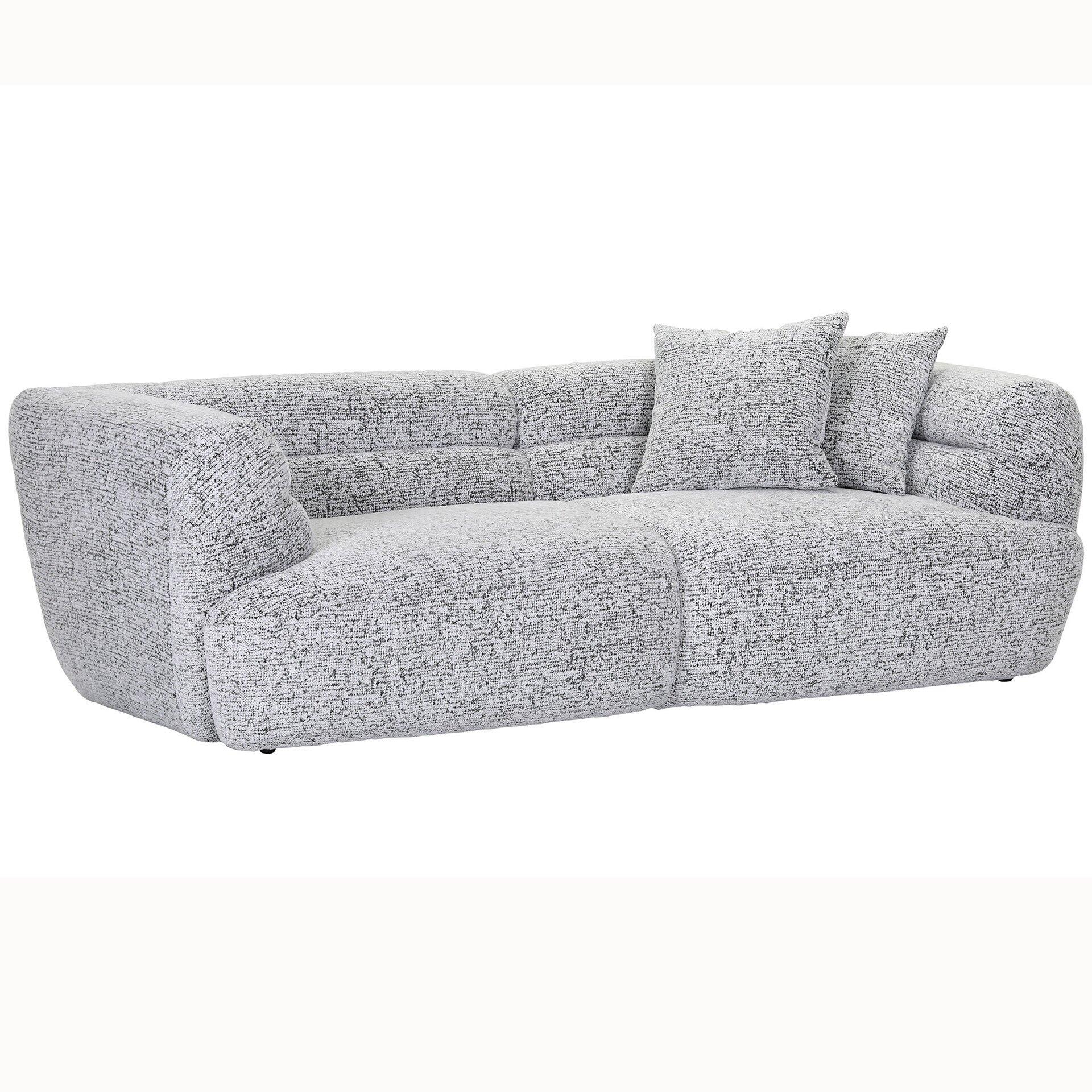Megasofa Neelia, dreisitzige Couch mit abgerundeter Form, hohen Armlehnen, hellgrauem Stoffbezug und zwei passenden Kissen auf der Rückenlehne.