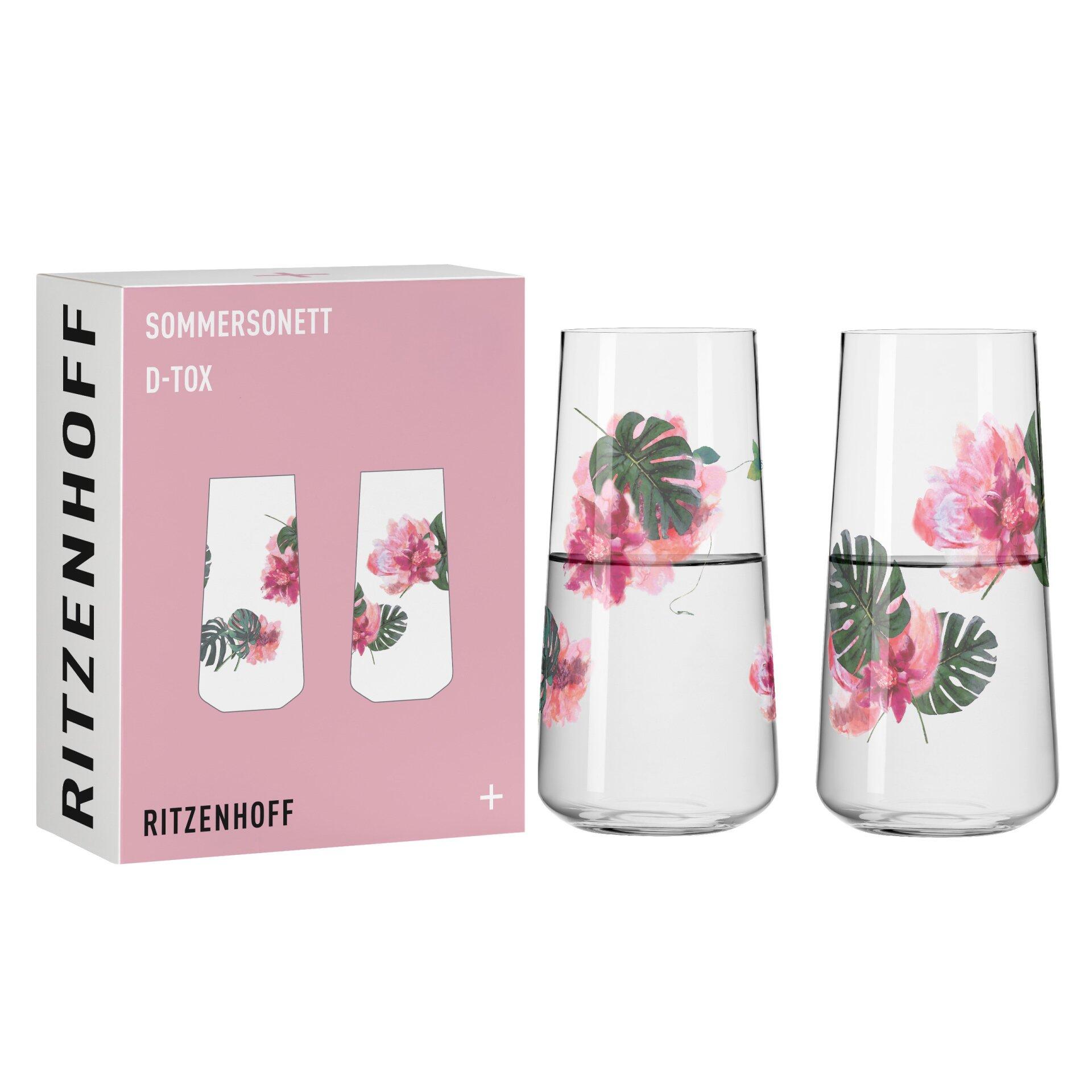 Zwei zylindrische Universalgläser mit floralem Blütenmotiv, teilweise mit Wasser gefüllt, auf weißem Untergrund präsentiert.