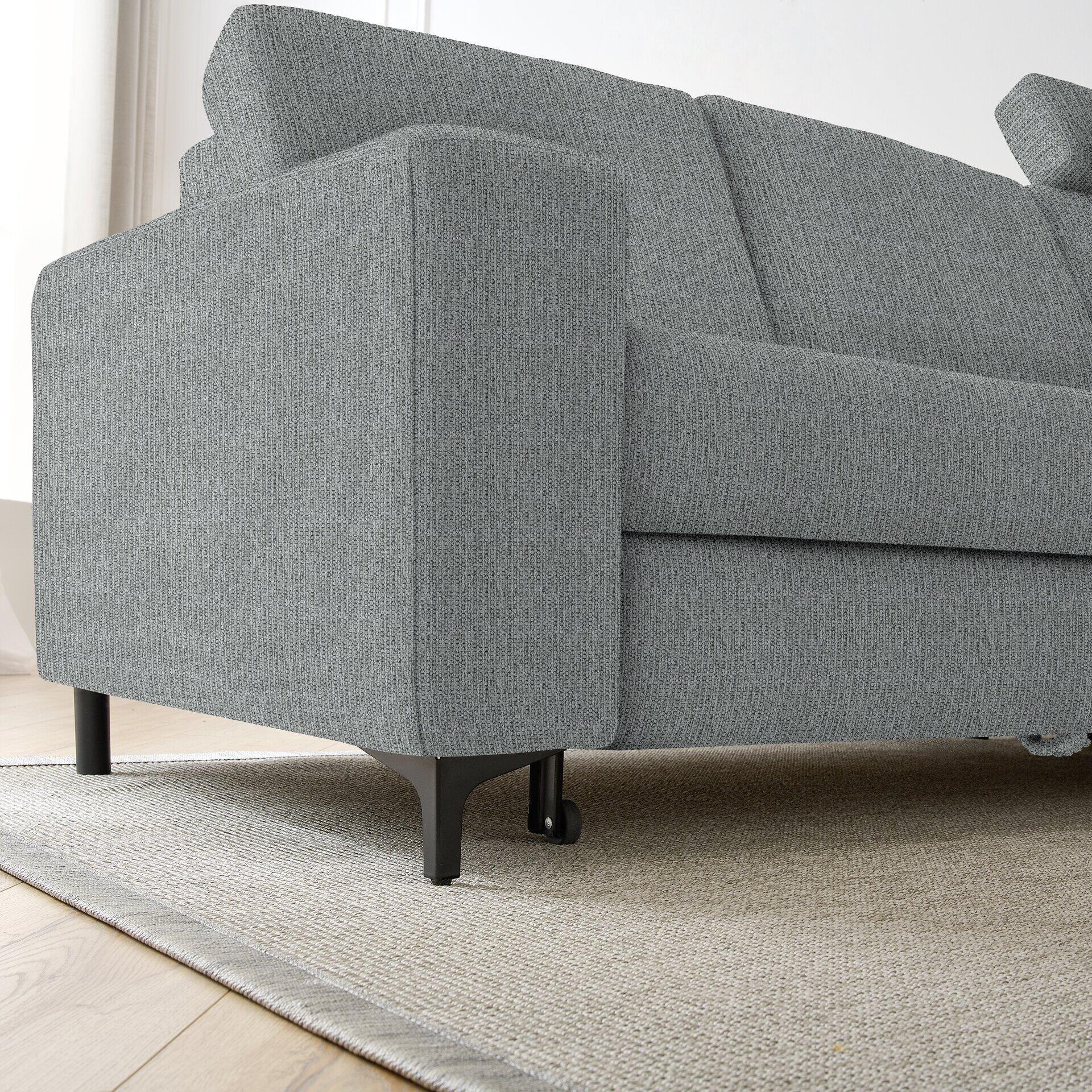 Graues Ecksofa Balina mit schmalen, schwarz lackierten Metallfüßen und strukturierter Oberfläche im modernen Design.