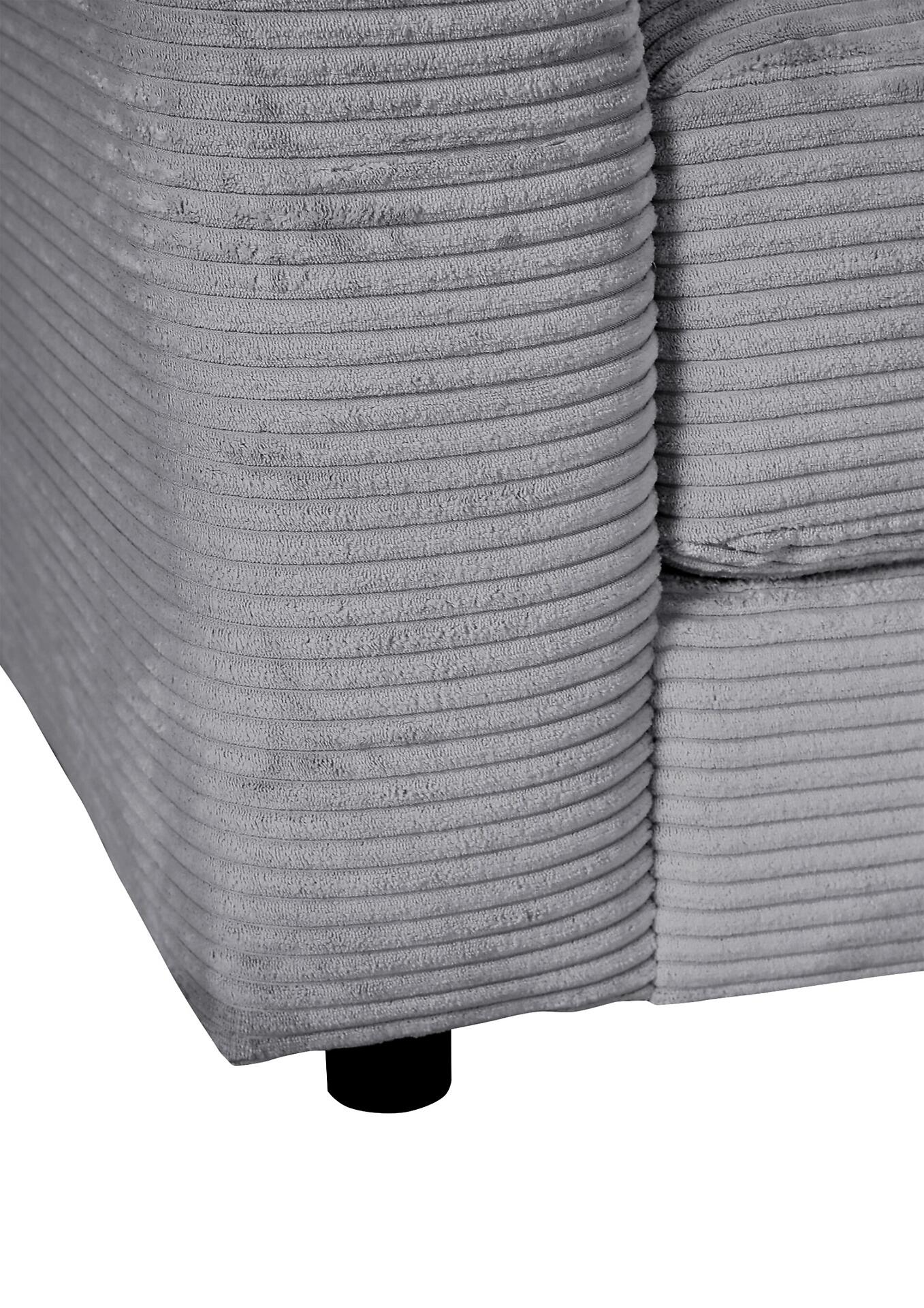 Detailaufnahme der grauen Cord-Polsterung und der schwarzen Fußkappe der Polsterecke Limato, die die hochwertige Materialausführung und das Design betont.