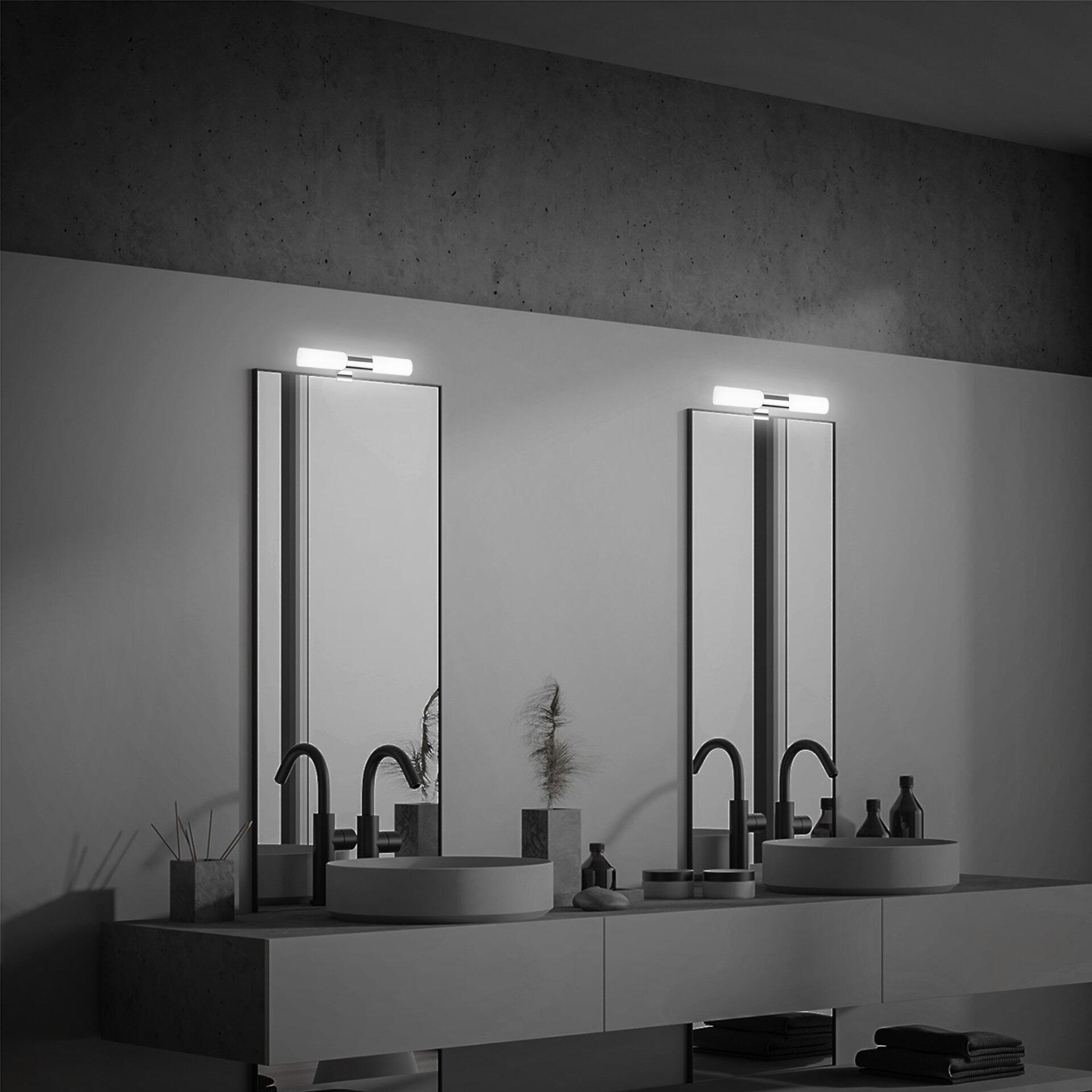 Minimalistisches Badezimmer mit zwei weißen Keramikwaschbecken, schwarzen Wasserhähnen und Betonwänden.