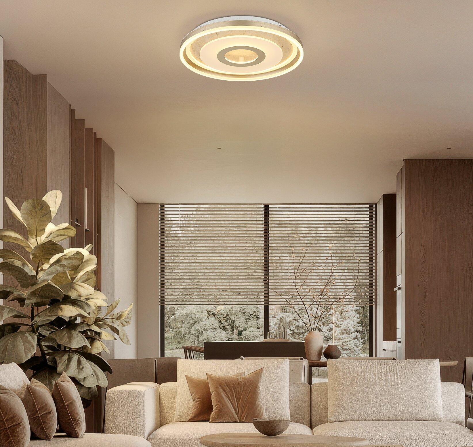 Deckenleuchte CARDENAS mit minimalistischem Design und mehreren konzentrischen, ringförmigen Elementen, die warmes Licht ausstrahlen.